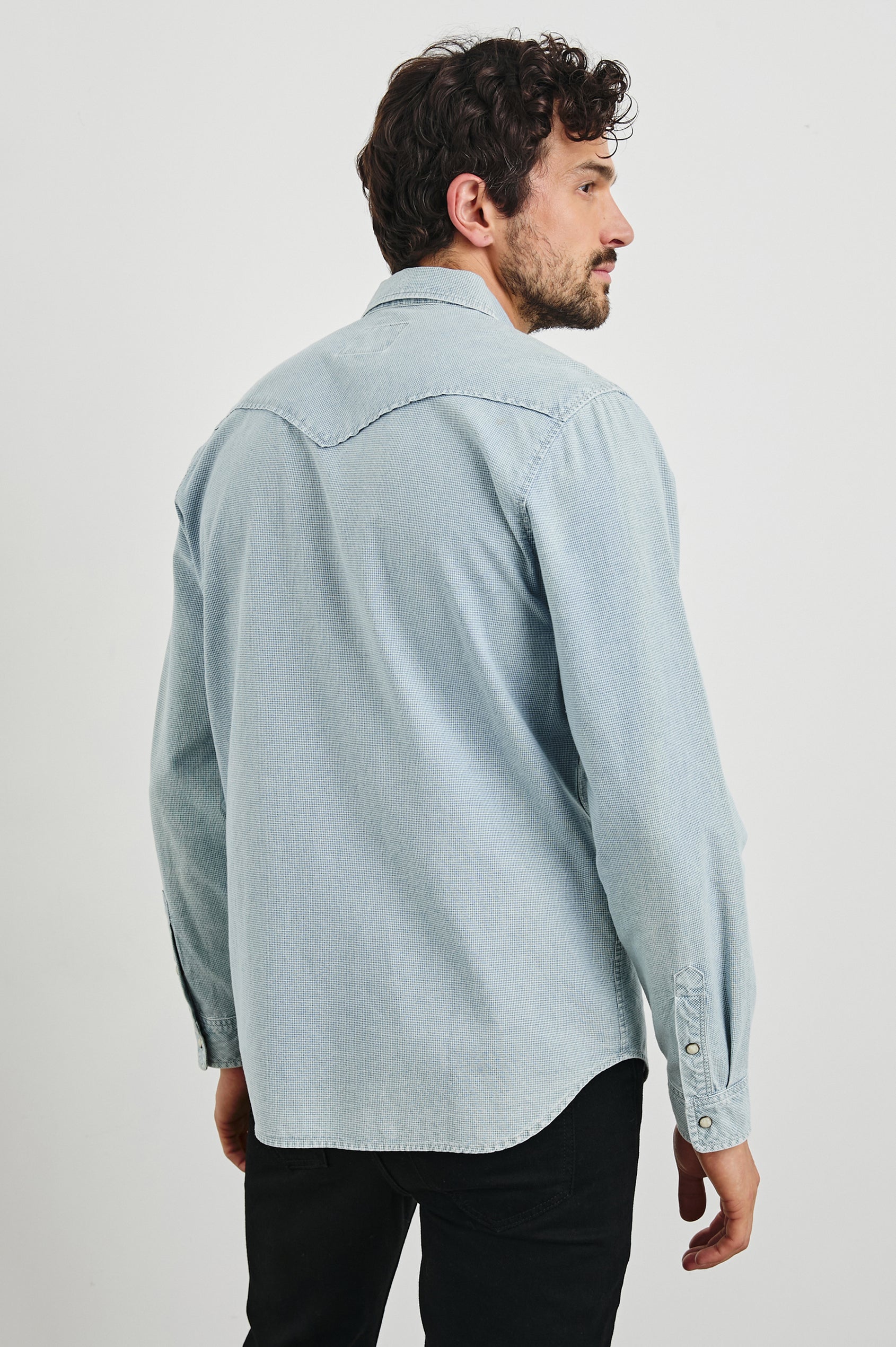 Roy Long-Sleeve with Snap Closure, Two Chest Snap Flap Pockets and Traditional Western Yokes in Sunfaded Indigo Colorway - Back View Featured on Model   
