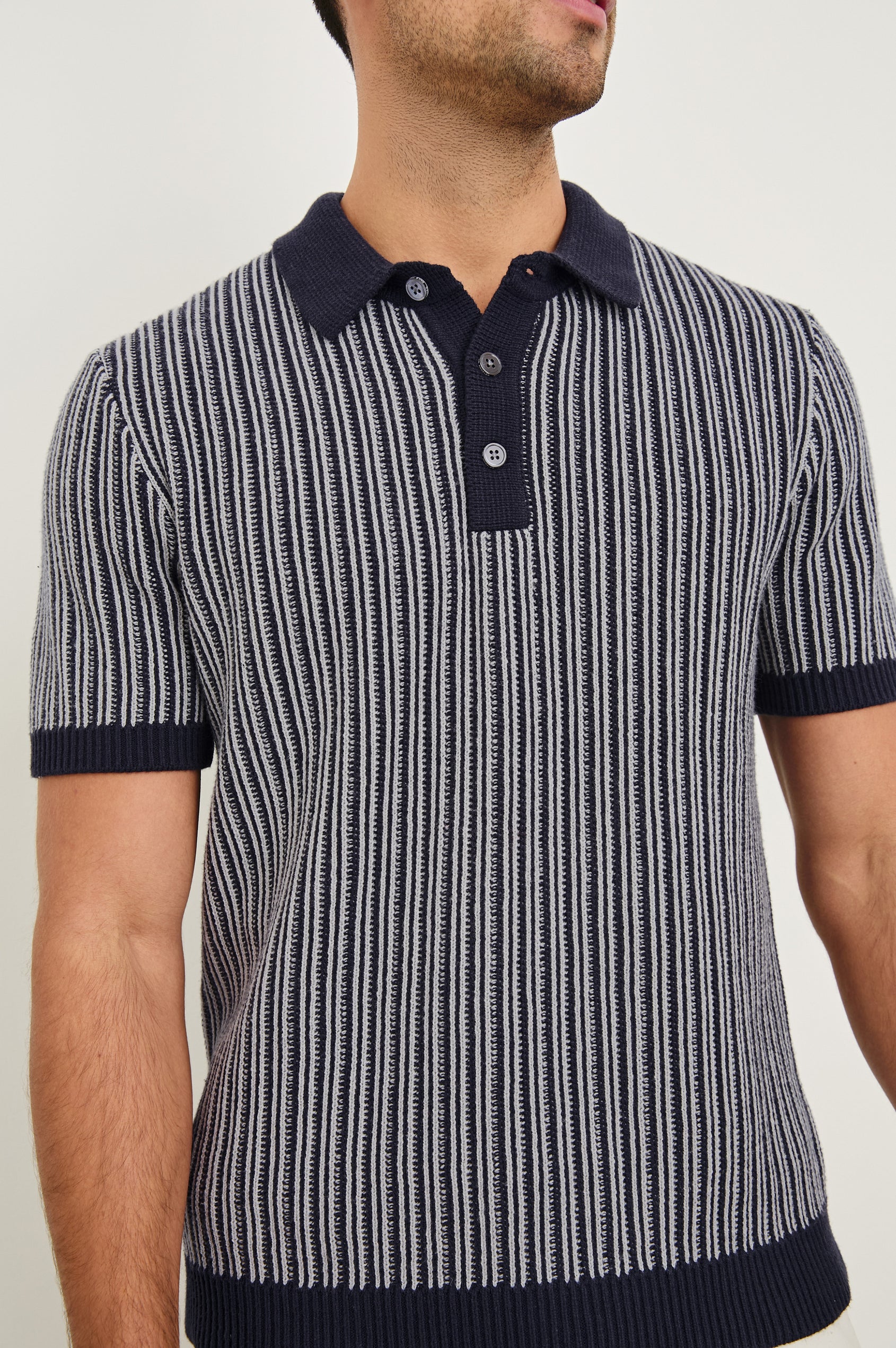 Royce ribbed knit short sleeve polo with three front buttons and a collar in Navy Grey - close up of details