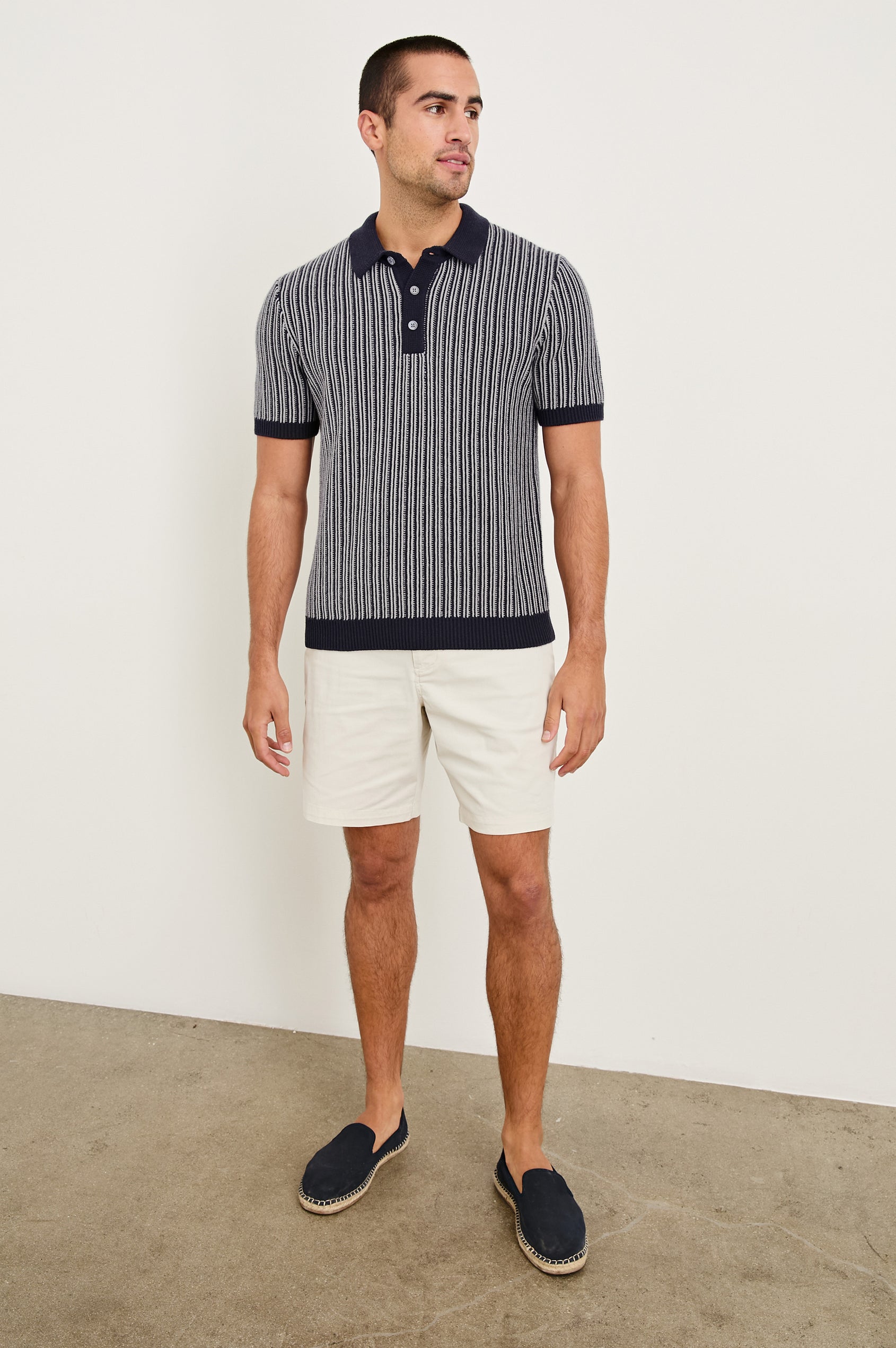 Royce ribbed knit short sleeve polo with three front buttons and a collar in Navy Grey - full body front view on model
