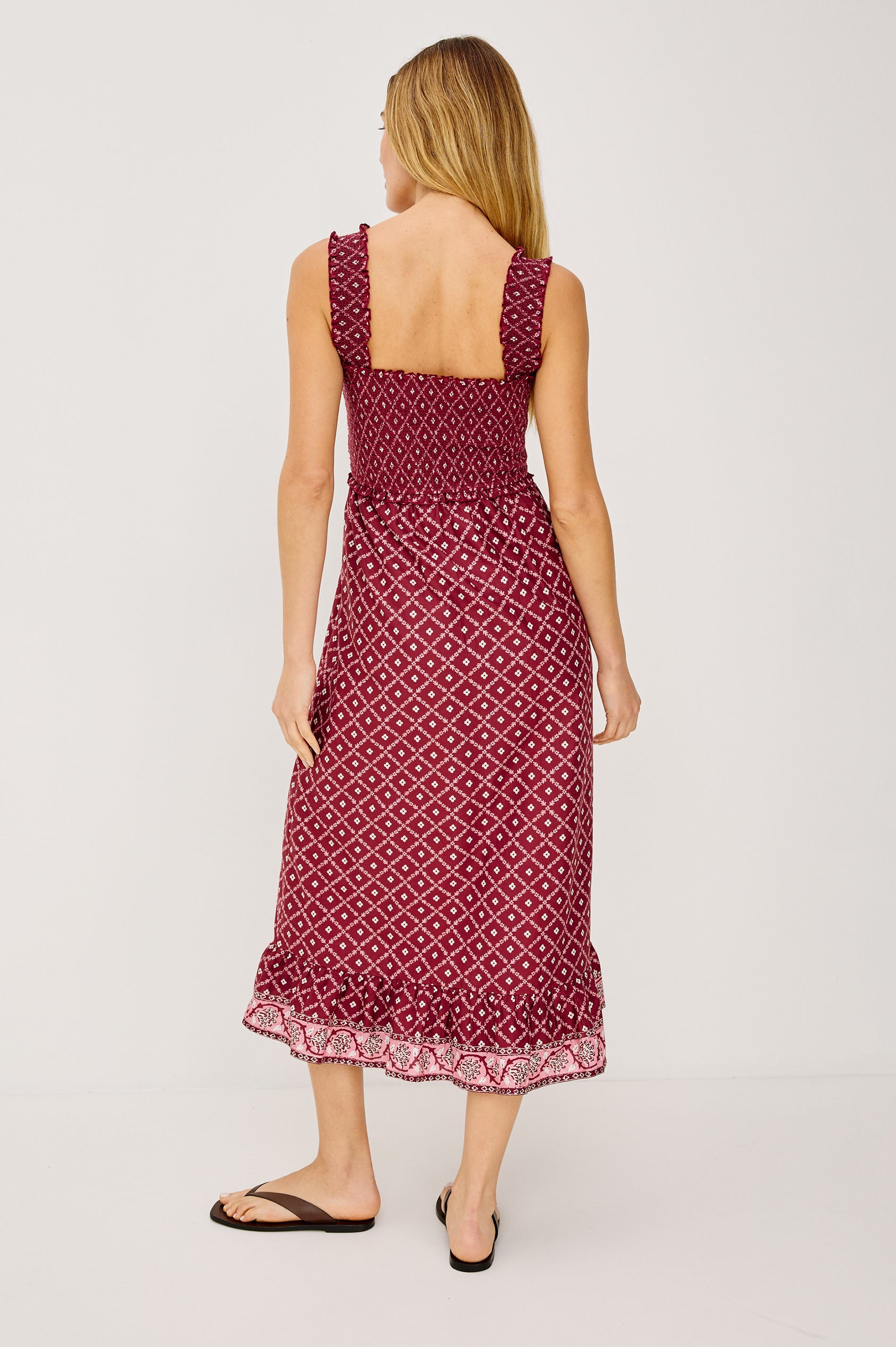 Rumi Midi Dress in Cotton Voile With Smocked Shoulder Straps and Bust, Empire Waist, and Ruffle Hem in Flower Chain Colorway - Full Body Back View Featured on Model