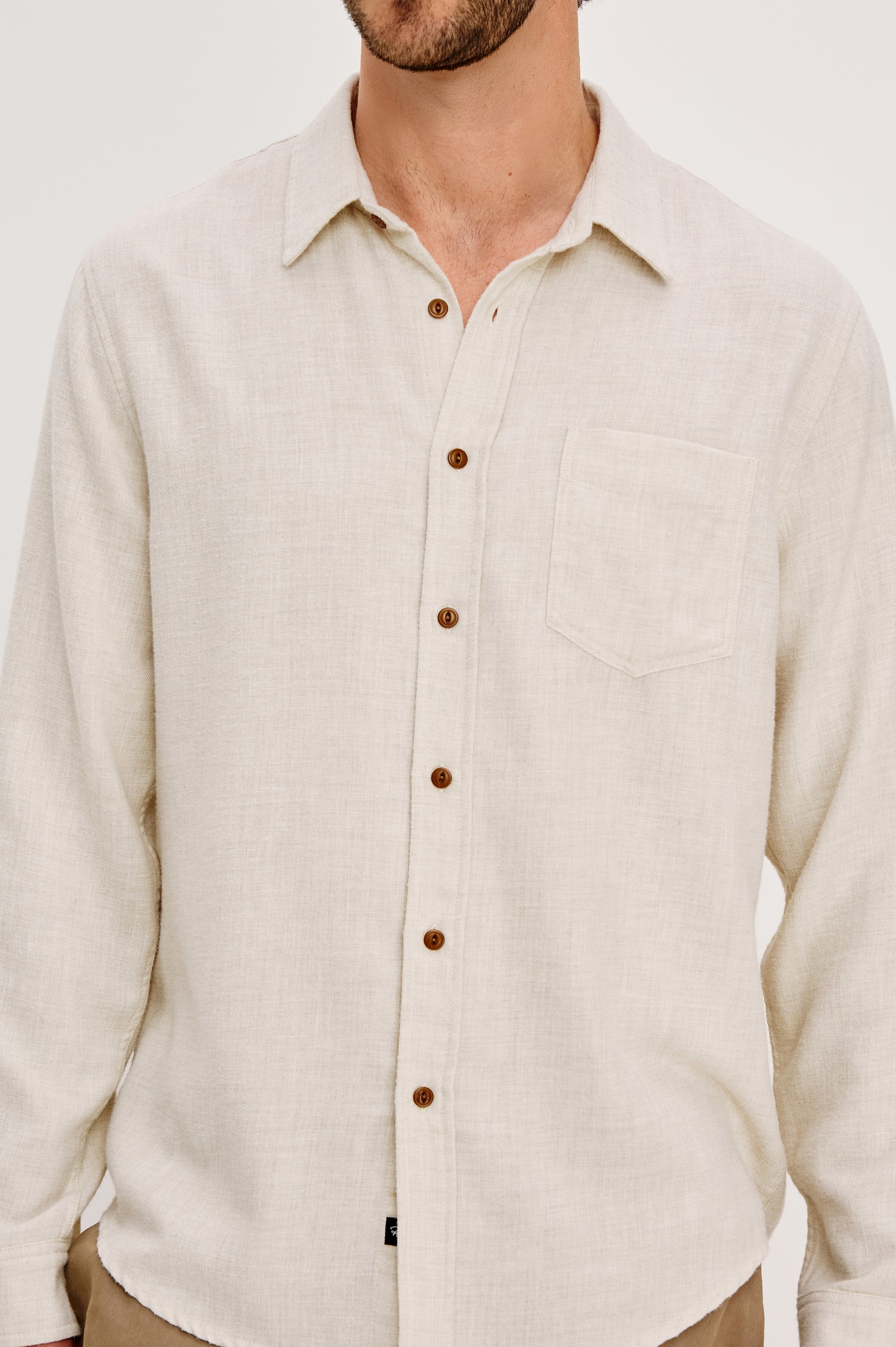 Runson Long-Sleeve Button Down with a Chest Patch Pocket in Cream Heather Colorway - Front Detail View Featured on Model