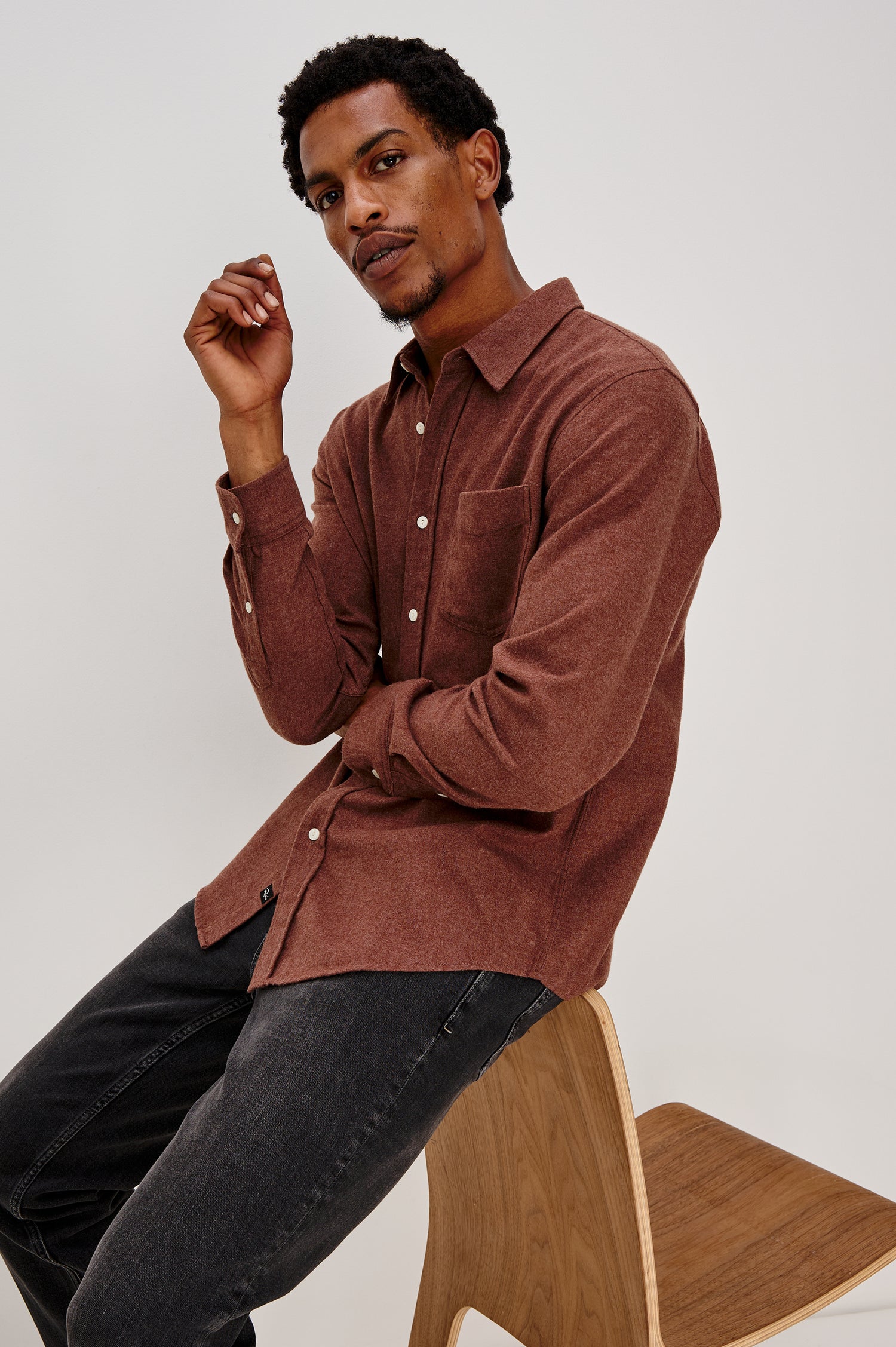 Runson Long-Sleeve Button Down with a Chest Patch Pocket in Mohagany Heather Colorway - Front Seated View Featured on Model