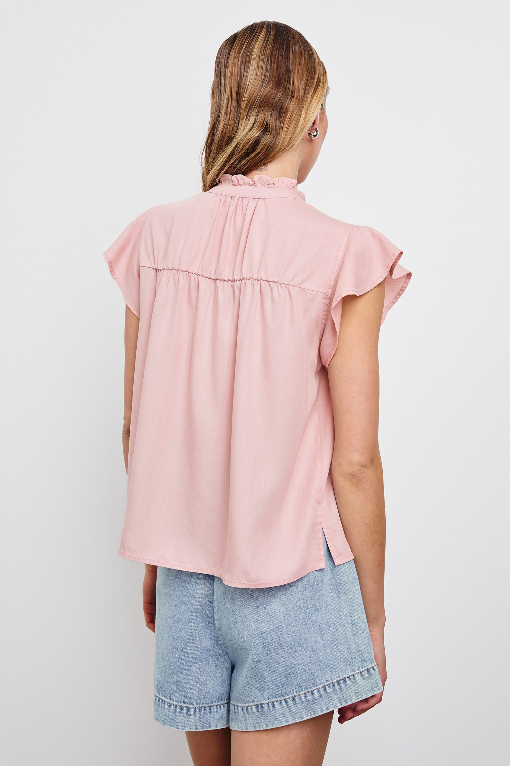 Ruthie Top with Flutter Cap Sleeves, a Ruffled Banded Collar, Buttons Down the Front, and Soft Shirring at Front Yoke in Dusty Rose Colorway - Back  View Featured on Model