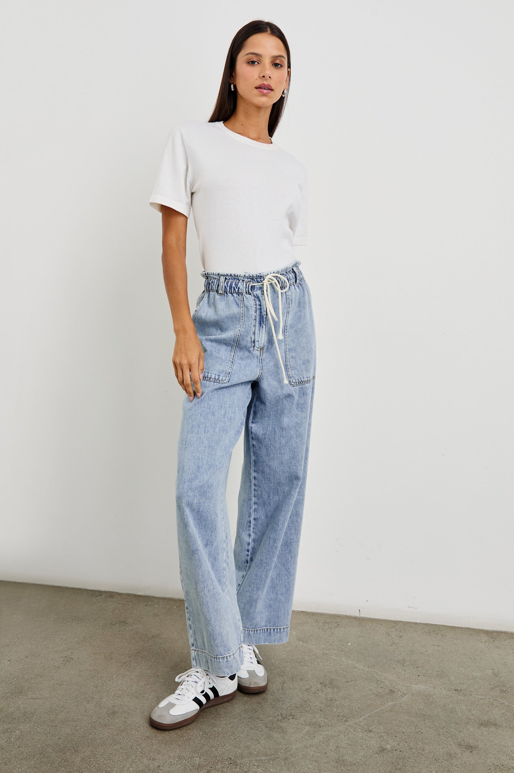 Ryan high rise linen pant with shirred waist and drawstring in light wash Faded Indigo- full body front view on model