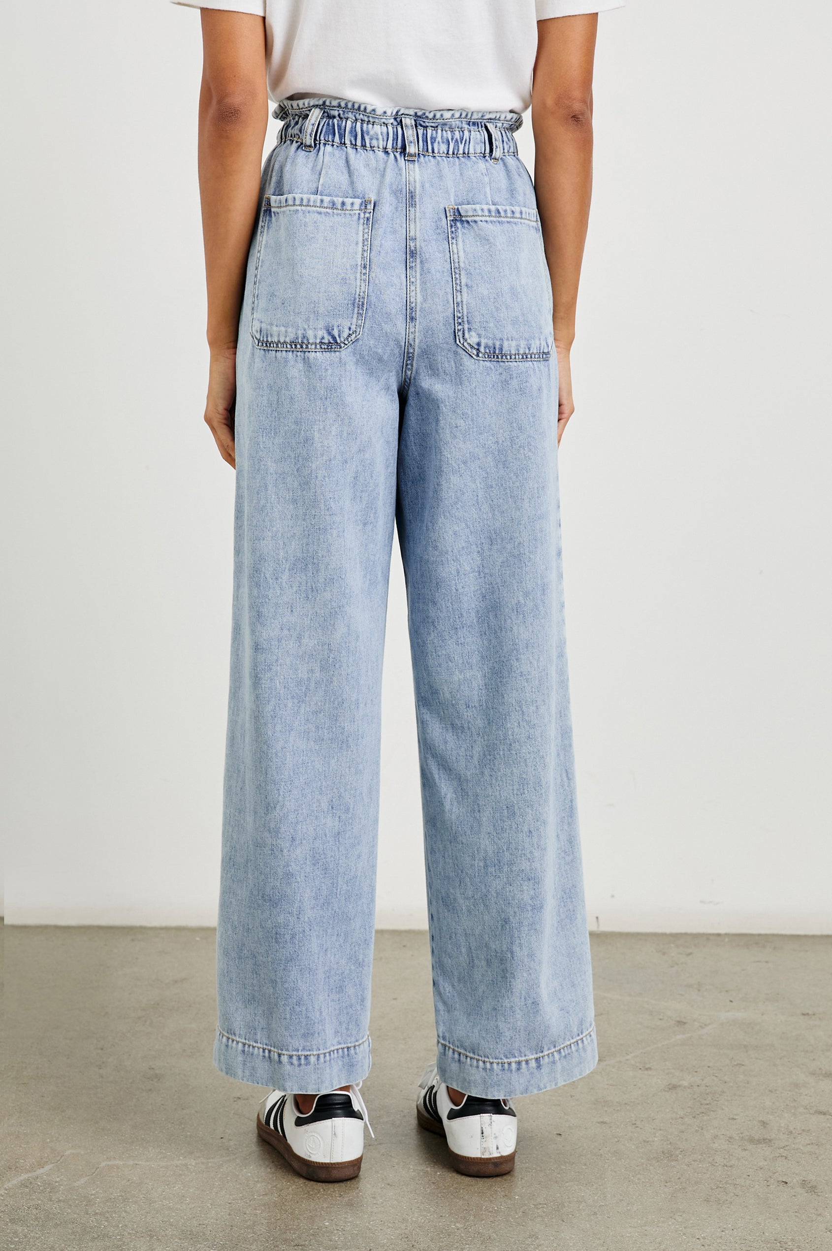 Ryan high rise linen pant with shirred waist and drawstring in light wash Faded Indigo- back view on model