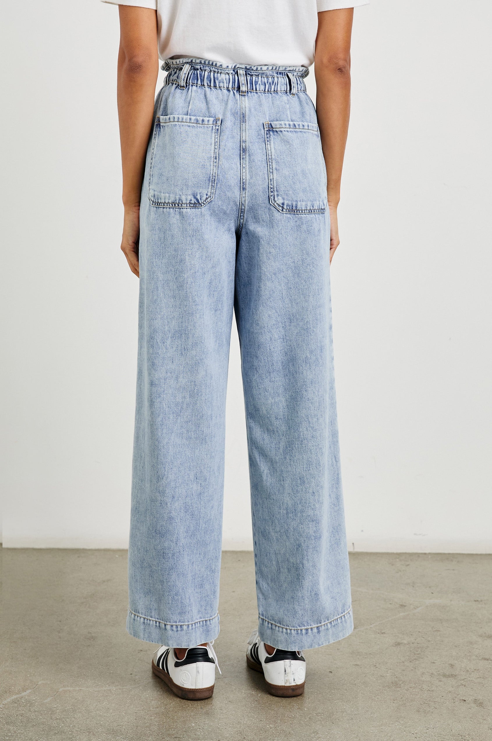 Ryan high rise linen pant with shirred waist and drawstring in light wash Faded Indigo- back view on model
