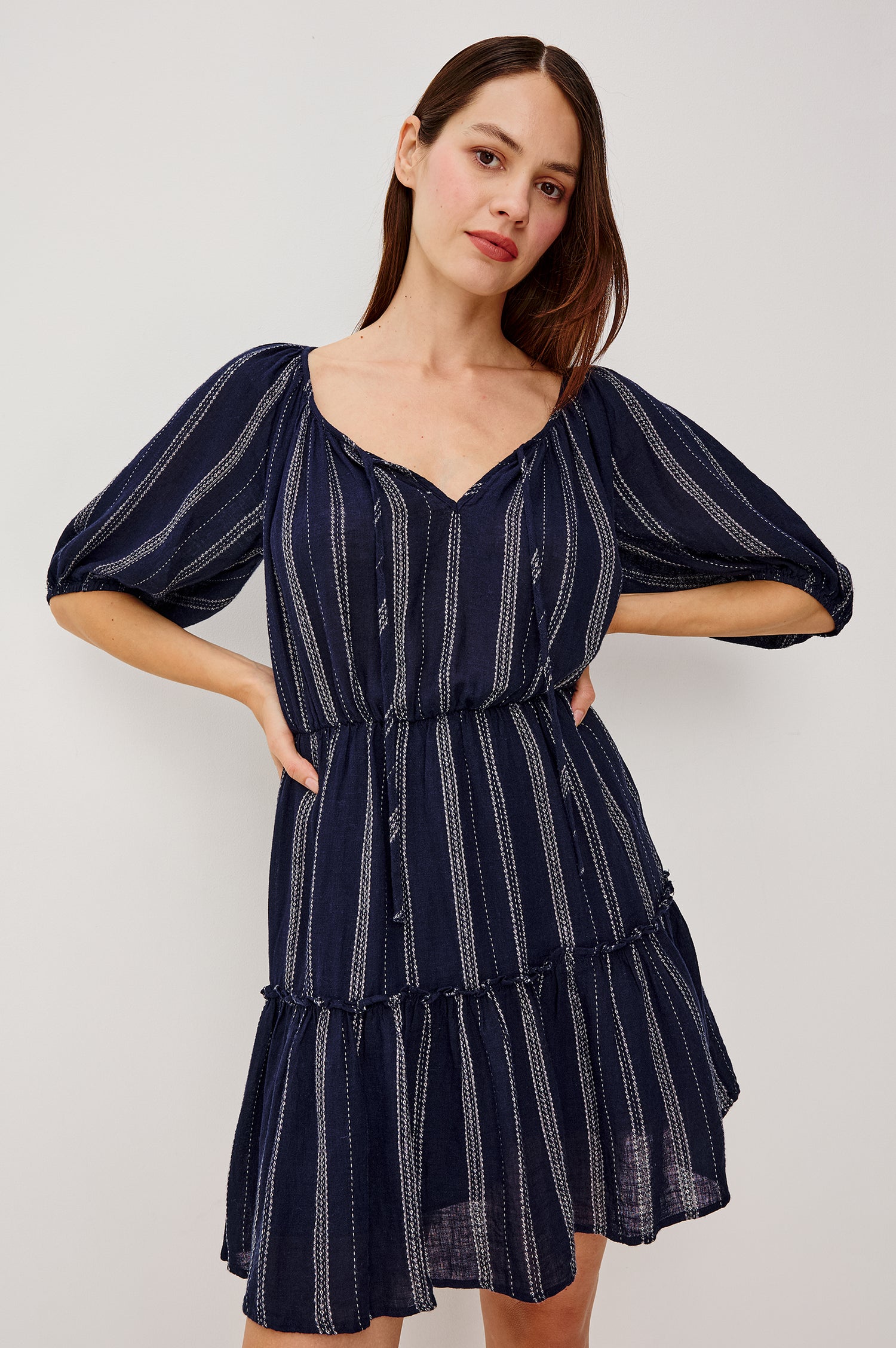 Saba Linen Mini Dress With Scoop Neckline Center-Front Ties Elbow-Length Puff Sleeves in Marina Stripe Colorway - Upper Body Front View Featured on Model