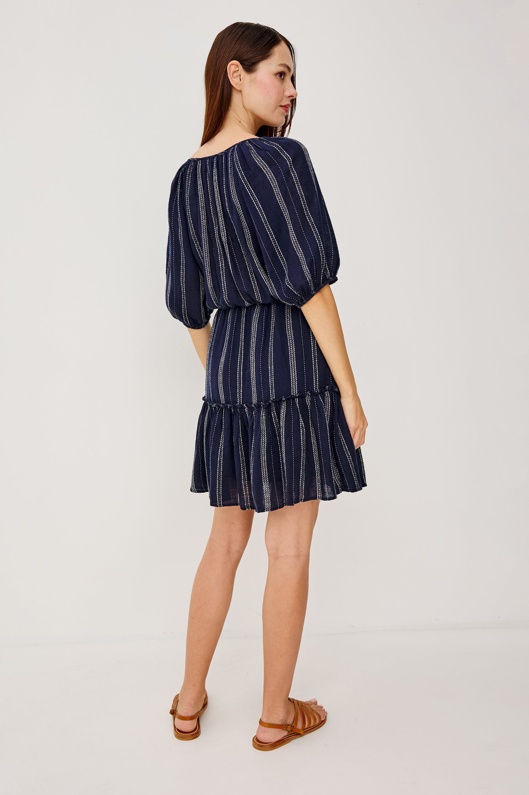 Saba Linen Mini Dress With Scoop Neckline Center-Front Ties Elbow-Length Puff Sleeves in Marina Stripe Colorway - Full Body Back View Featured on Model