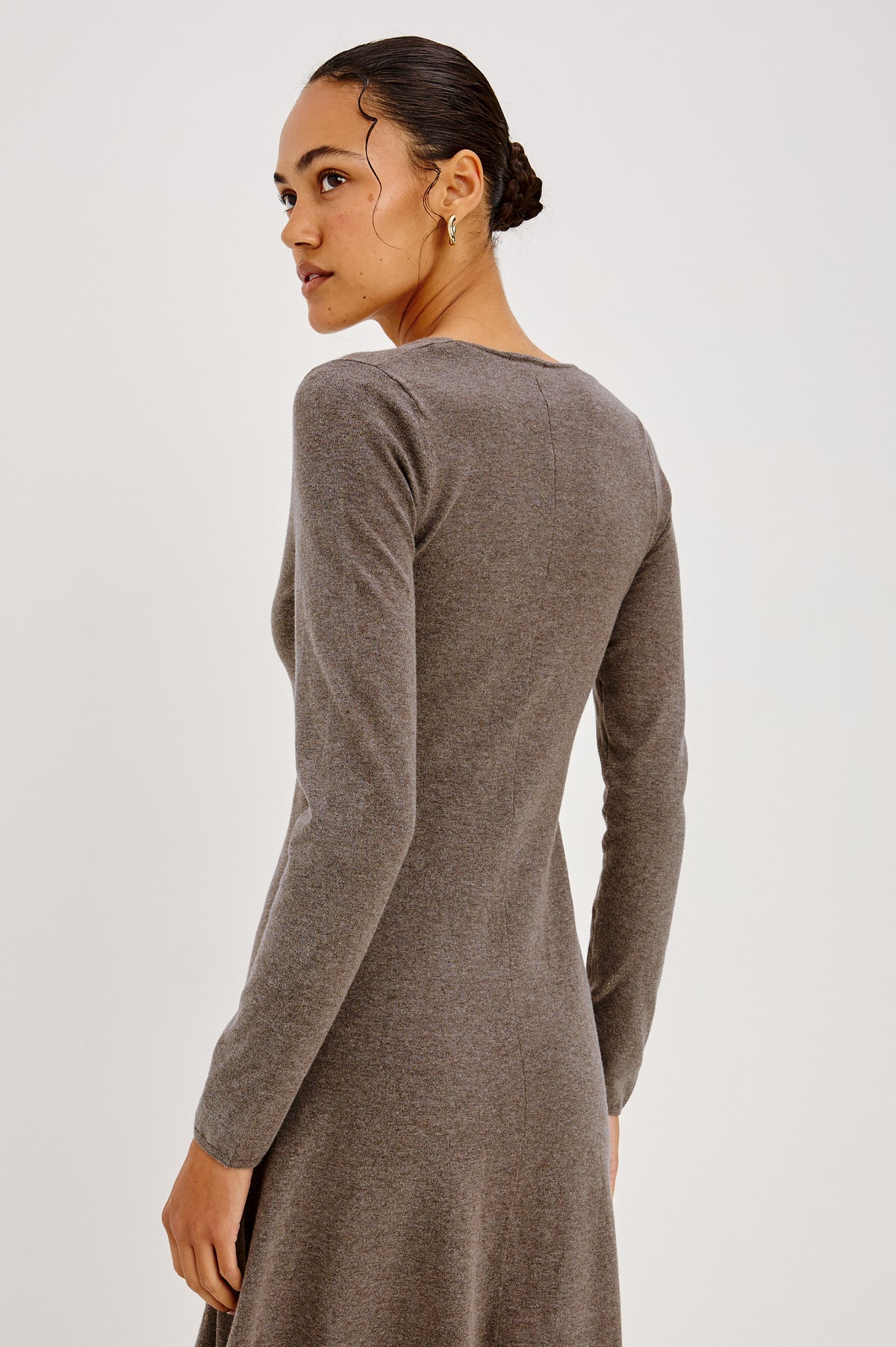 Sabrina Midi Dress in Fine Knit With Fitted Bodice, V-Neckline, Front Seam, and A-line Skirt in Heather Latte - Back Full Body View Featured on Model.