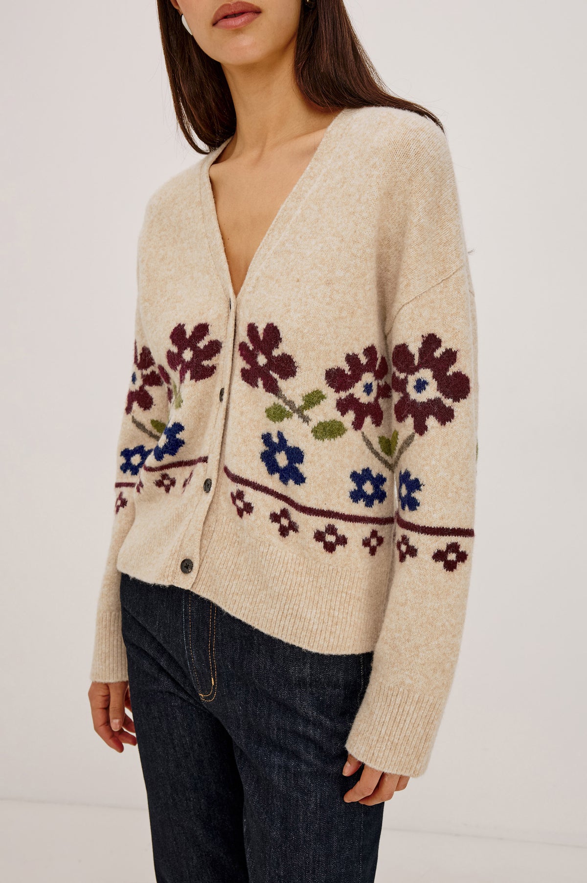 Saffron Cardigan in Wool Blend Knit With Relaxed Slightly Oversized Fit, Front Buttons, and Ribbed Trim in Oat Floral Colorway - Upper Body Front Detail View Featured on Model.