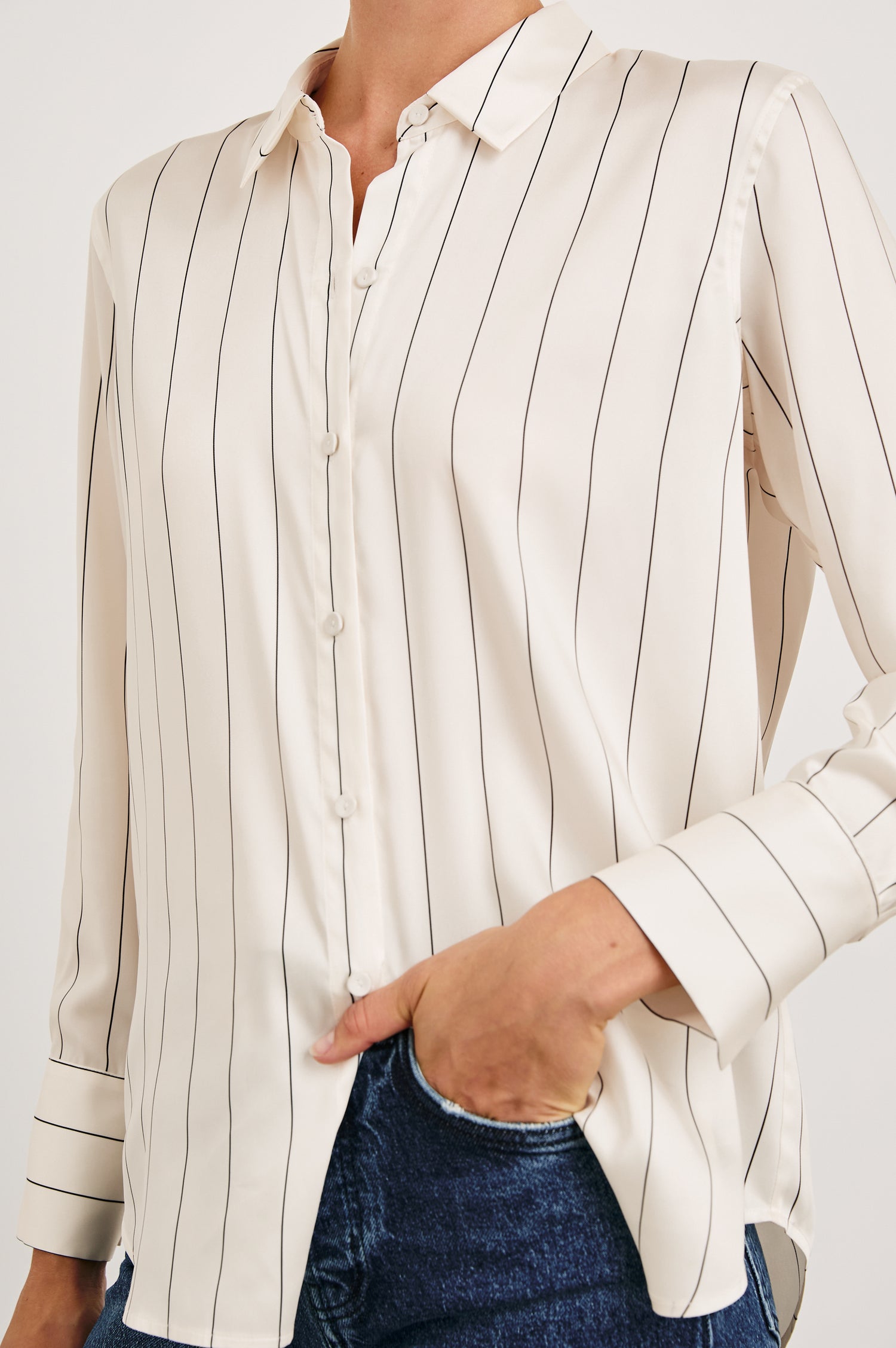 Saige Long-Sleeve Button Up in Brixton Stripe Colorway, Thin Black Stripes on Cream - Front View Featured on Model