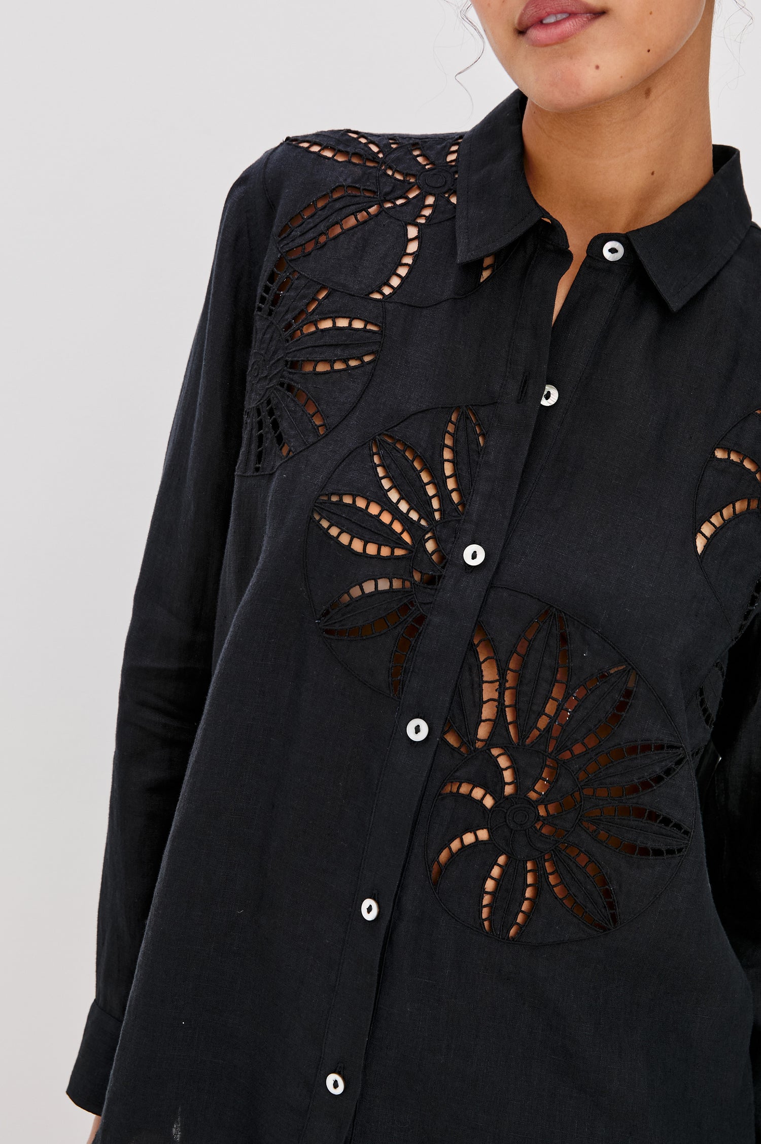 Samar Collared Button Front  Shirt with Long Sleeves and Floral Cutouts in Black Colorway. Front Detailed View Shown on Model.