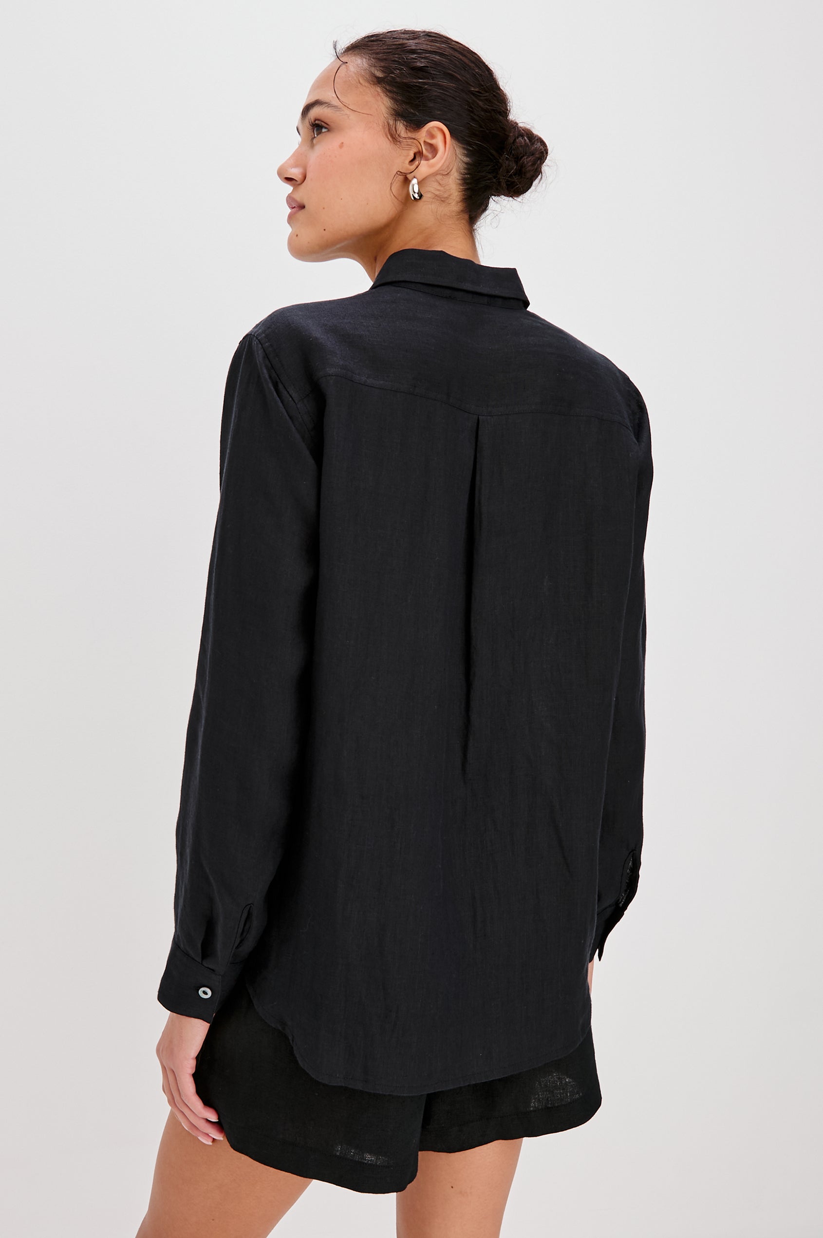 Samar Collared Button Front  Shirt with Long Sleeves and Floral Cutouts in Black Colorway. Back View Shown on Model.