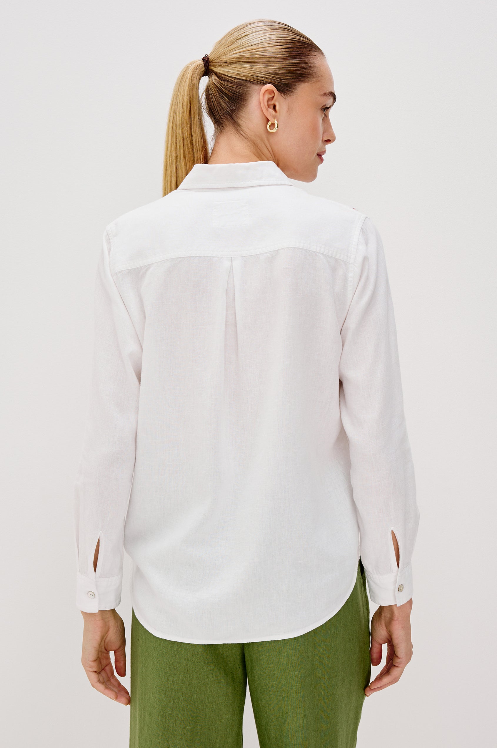 Samar Collared Button Front Top with Long Sleeves and Cutout Flower Details in White Colorway. Back View Shown on Model.