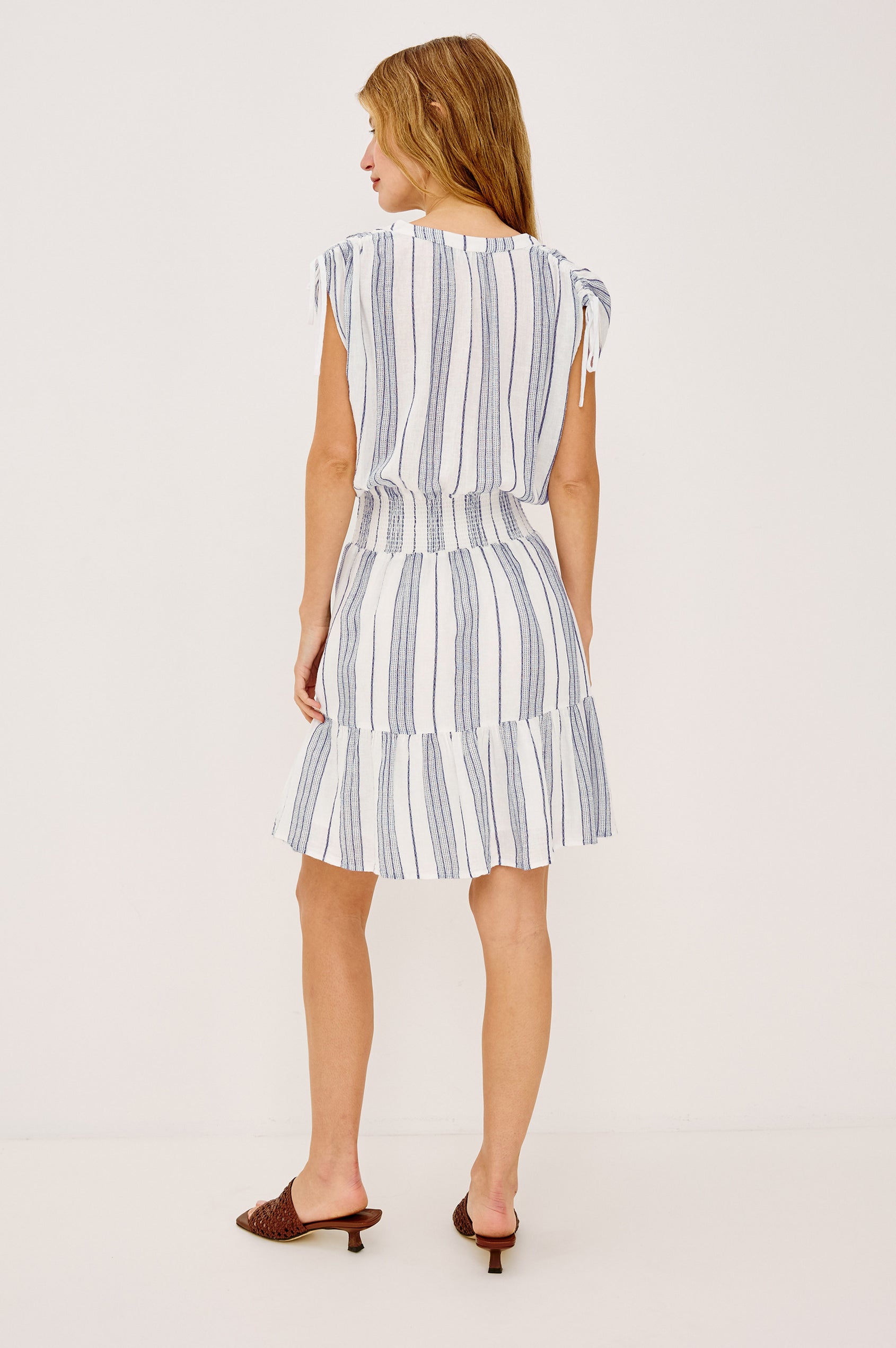 Samina Mini Dress in Luxe Linen With Half Placket Neckline, Front Buttons, Smocked Waist With Adjustable Drawstring Ties - Full Body Back View Featured on Model