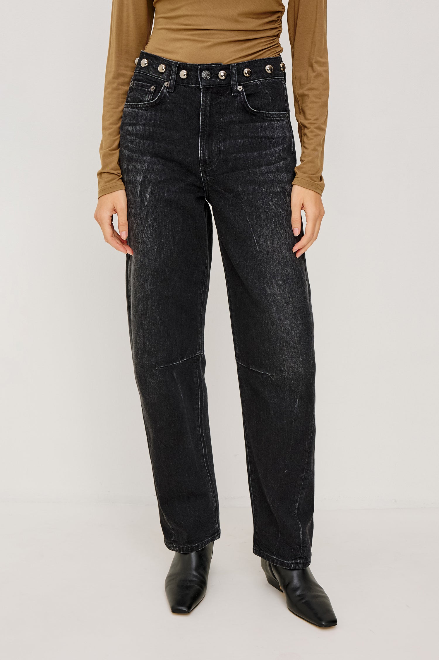Samo Barrel Jean in Subtle Stretch Denim With Metallic Nail-Back Studs at Waist, 5-Pockets, and Front Zip-Fly in Black Stone Studded Colorway - Lower Body Front View Featured on Model