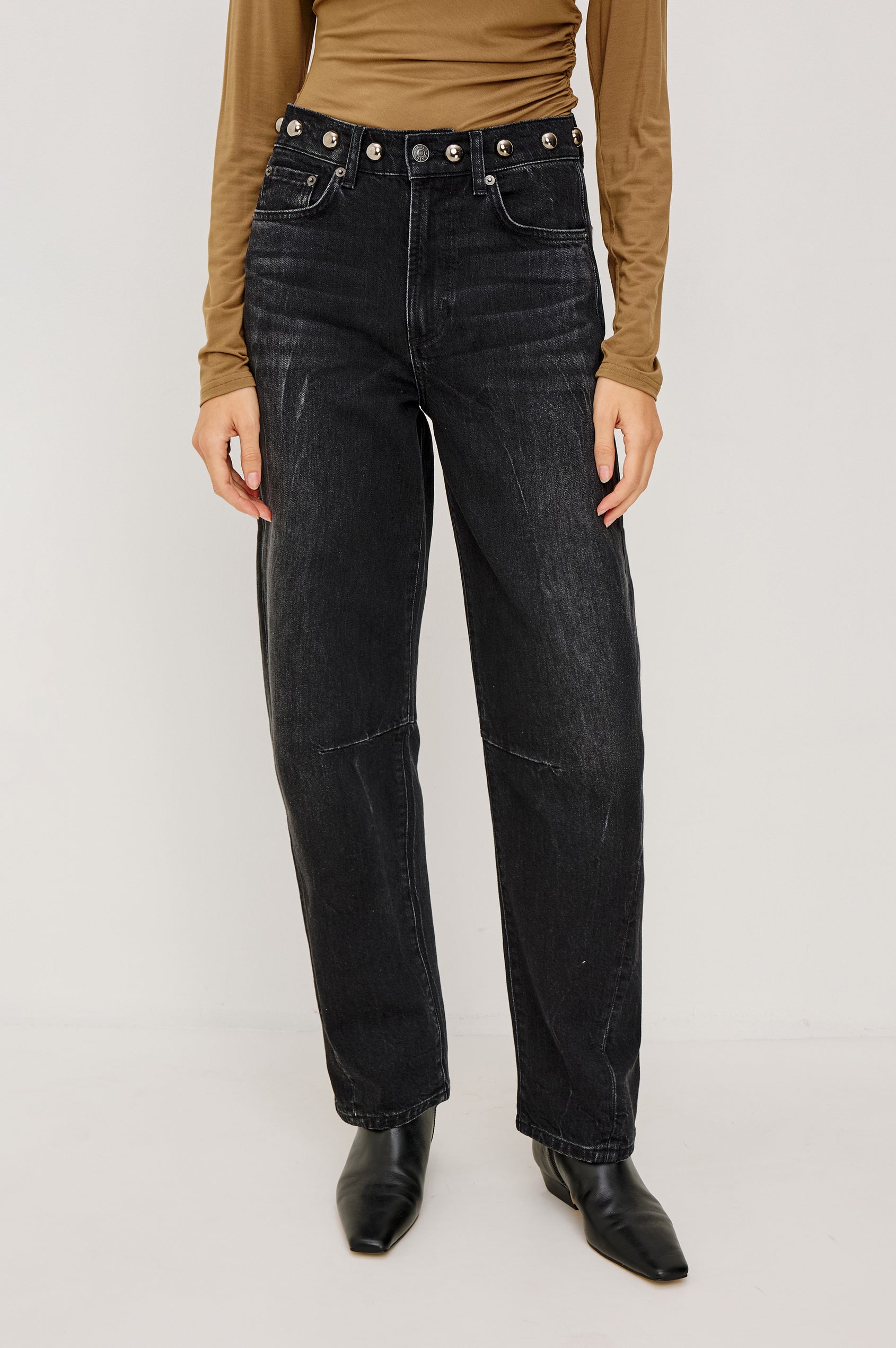 Samo Barrel Jean in Subtle Stretch Denim With Metallic Nail-Back Studs at Waist, 5-Pockets, and Front Zip-Fly in Black Stone Studded Colorway - Lower Body Front View Featured on Model