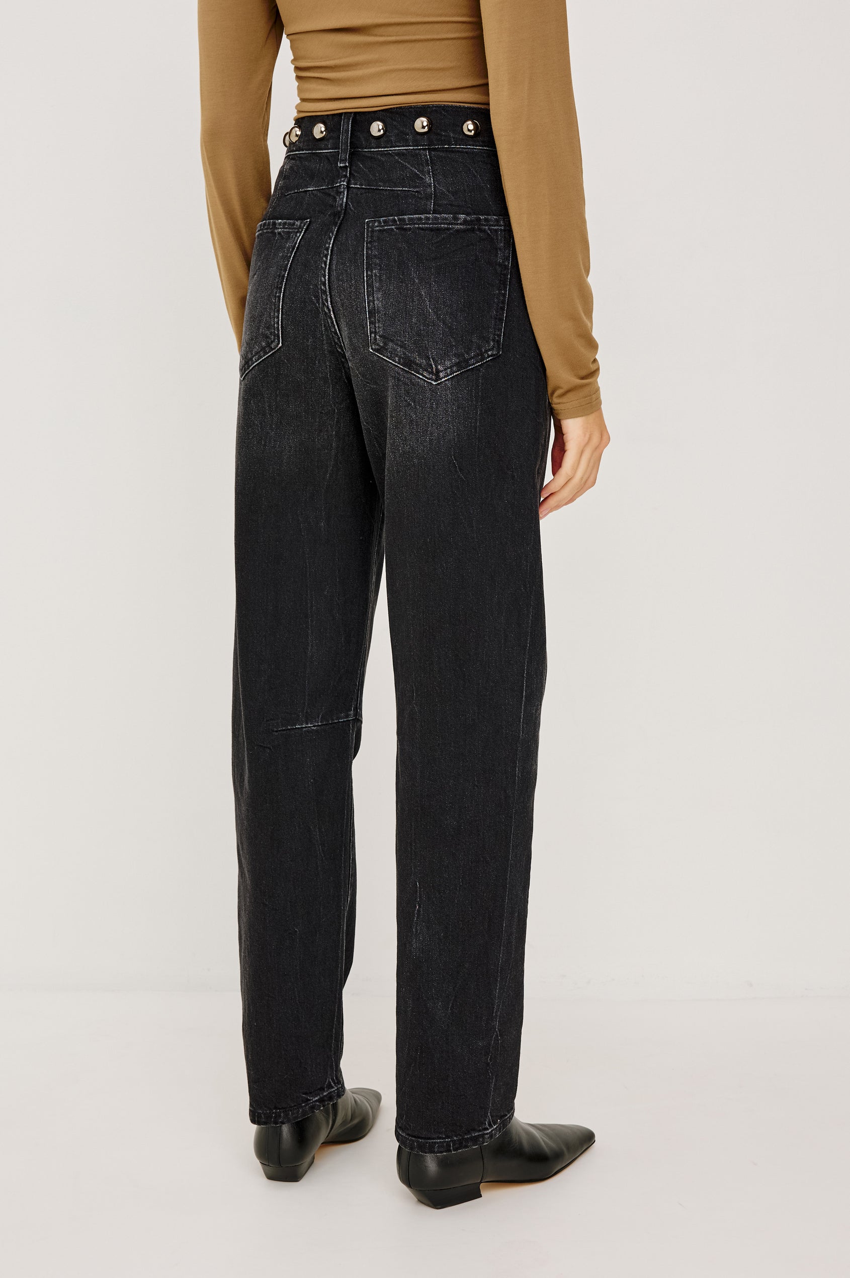 Samo Barrel Jean in Subtle Stretch Denim With Metallic Nail-Back Studs at Waist, 5-Pockets, and Front Zip-Fly in Black Stone Studded Colorway - Lower Body Back View Featured on Model