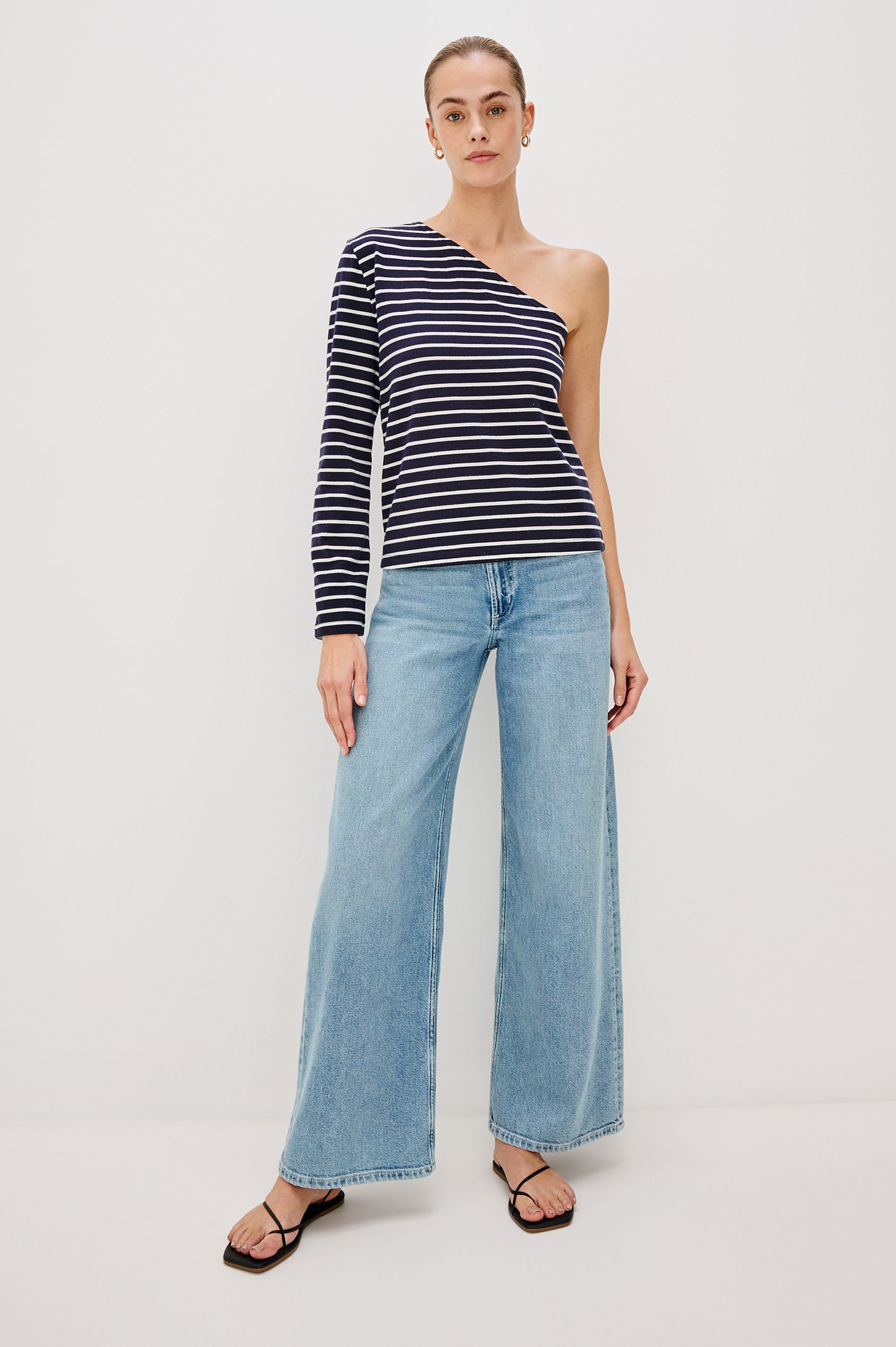 Sara One Shoulder Shirt with Long Sleeve in Blue/White Nautical Stripe Colorway. Full Body Front View Shown on Model.