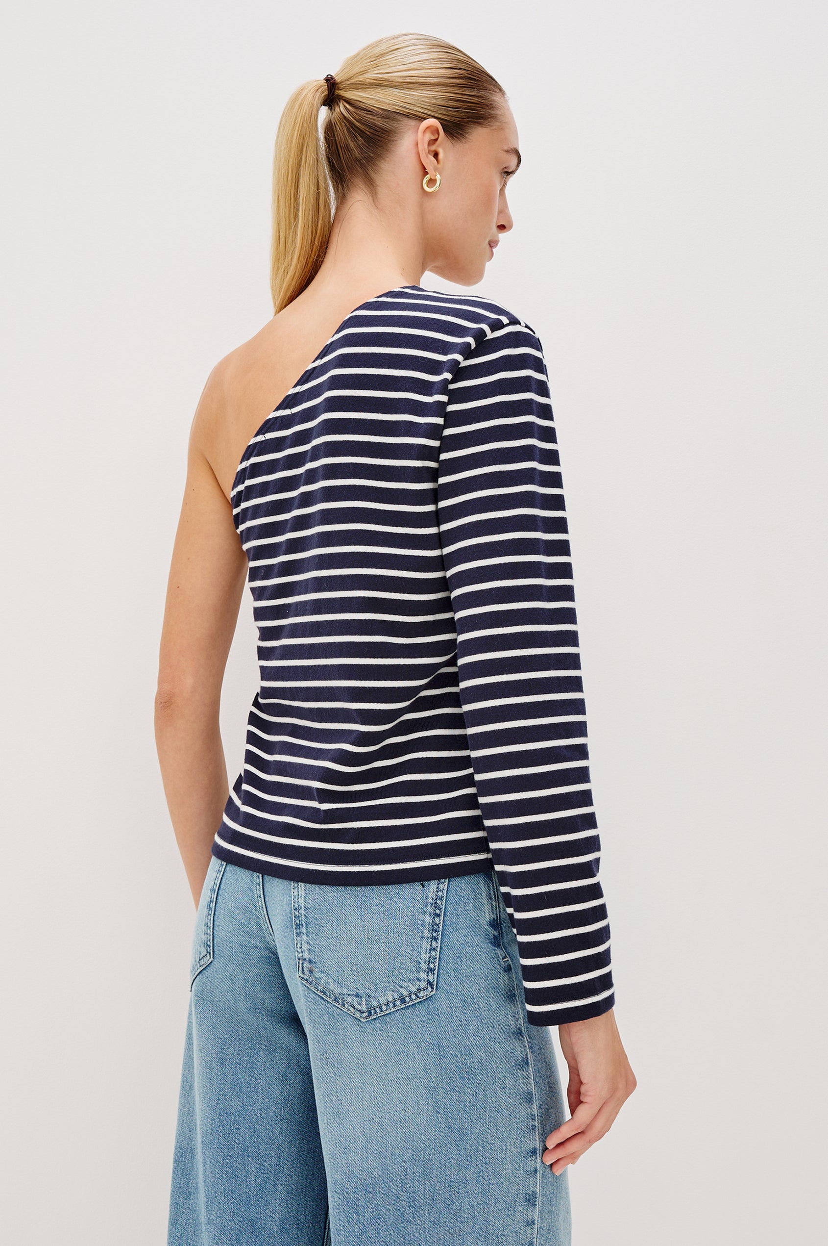 Sara One Shoulder Shirt with Long Sleeve in Blue/White Nautical Stripe Colorway. Back View Shown on Model.