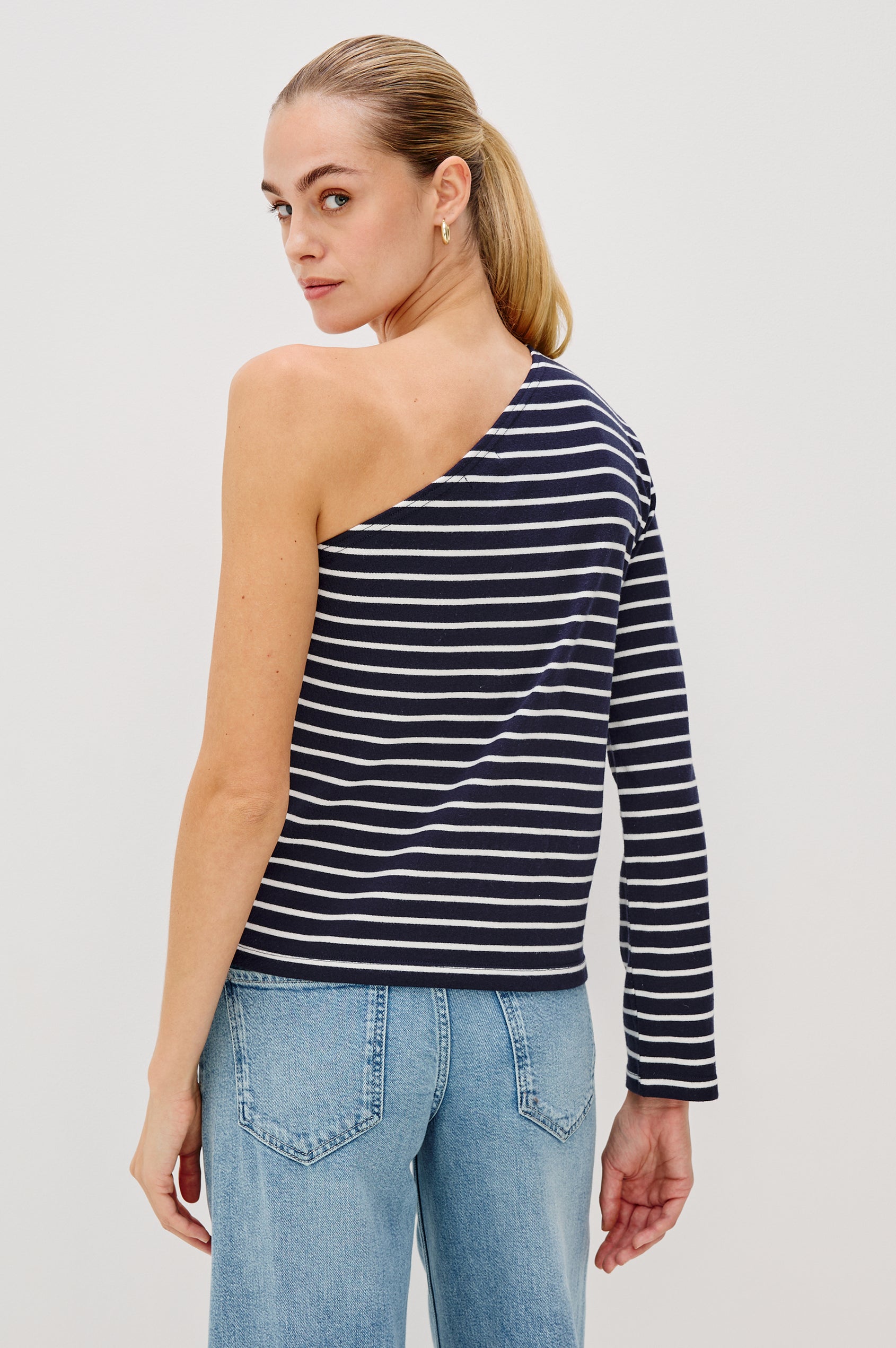 Sara One Shoulder Shirt with Long Sleeve in Blue/White Nautical Stripe Colorway. Back View Shown on Model.