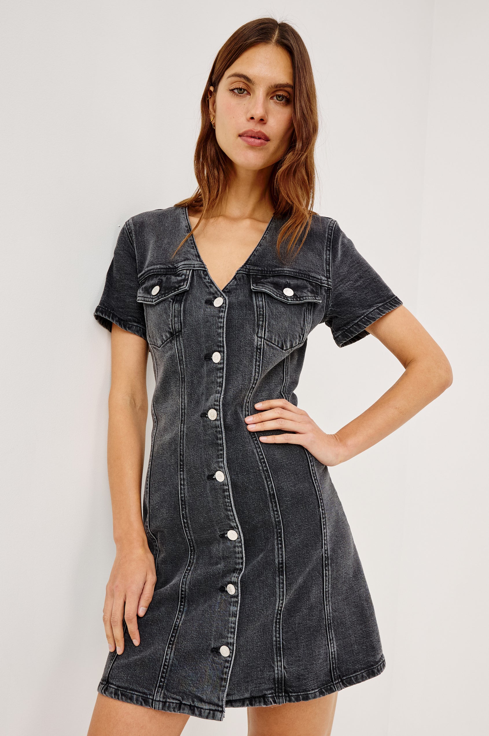 Saratoga Mini Denim Dress with a V-Neck, Short Sleeves, Button Front, Chest Flap Pockets in Washed Black Colorway. Front View Shown on Model.