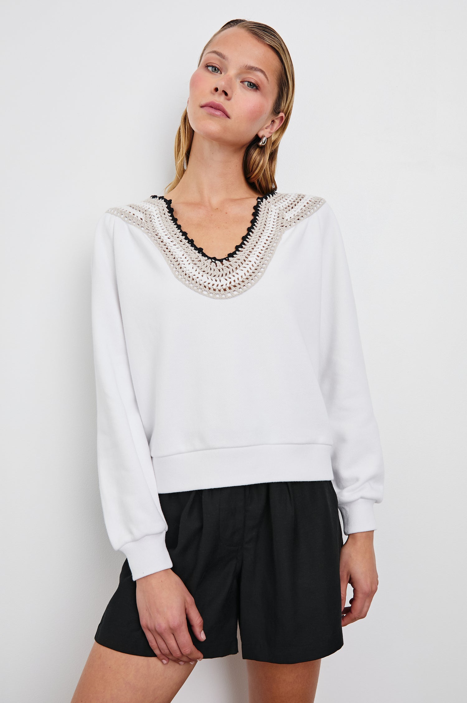 Sava Sweatshirt with V neck and Crochet along the Neckline in Ivory with Crochet Colorway, with cream, white and black crochet - Front View Featured on Model