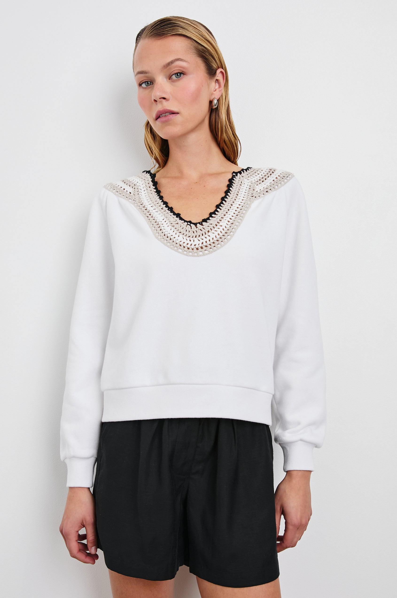 Sava Sweatshirt with V neck and Crochet along the Neckline in Ivory with Crochet Colorway, with cream, white and black crochet - Front View Featured on Model