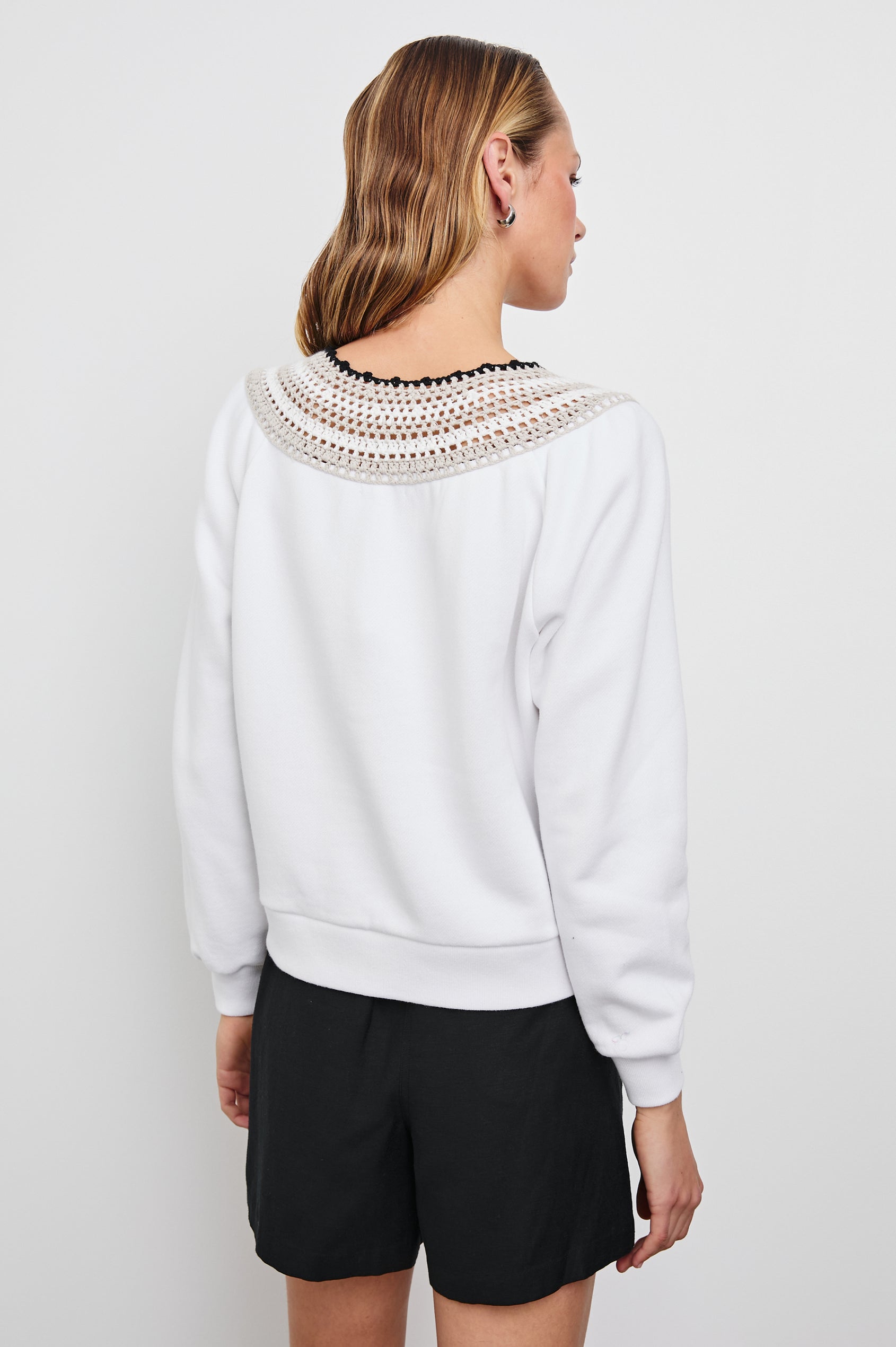 Sava Sweatshirt with V neck and Crochet along the Neckline in Ivory with Crochet Colorway, with cream, white and black crochet - Back View Featured on Model