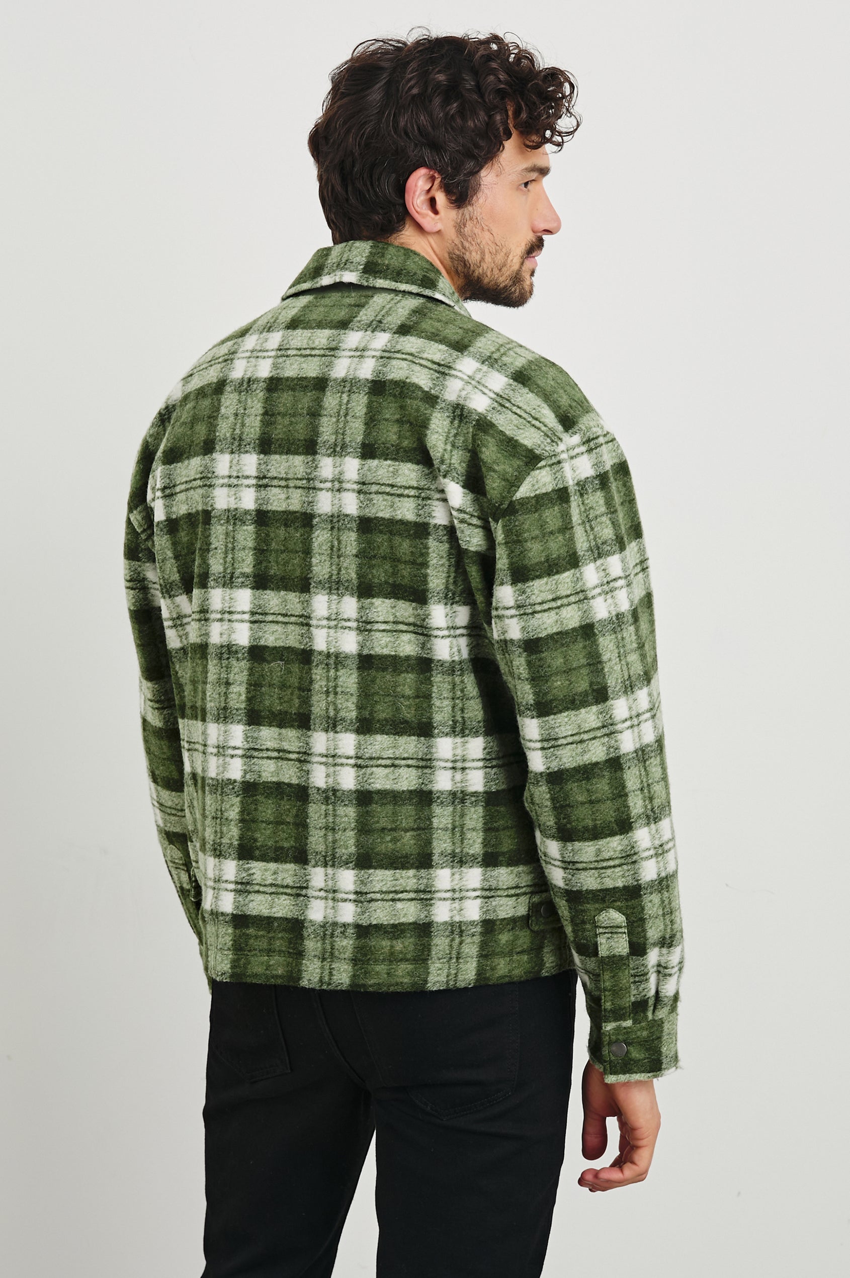 Saxon Jacket  with Snap Closure and Two Snap Chest Flap Pockets in Green Mist Colorway, a green and white plaid  - Back View Featured on Model