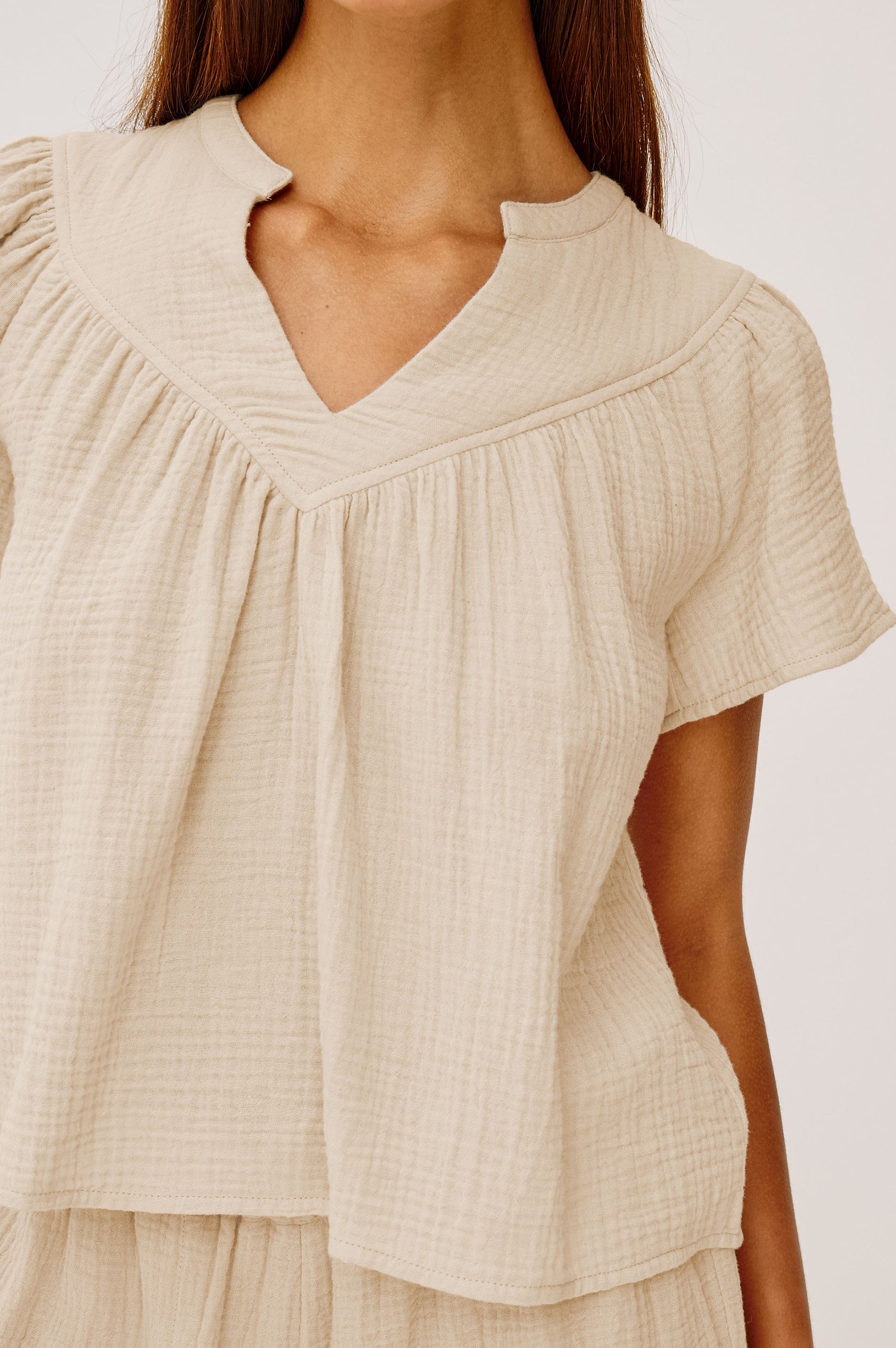 Sayer double cotton gauze flared short sleeve tee with V neckline in Flax - front view close up of details on model
