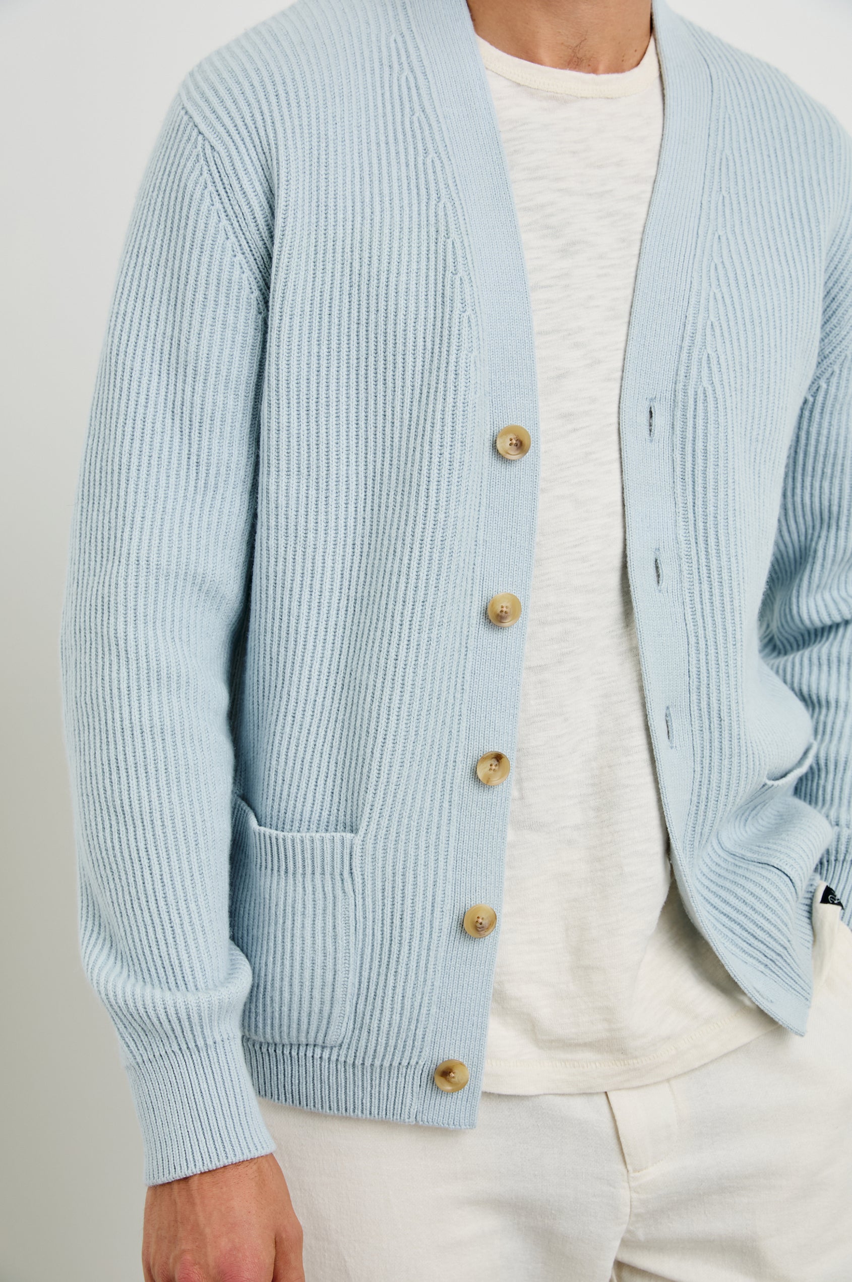 Sean Long-Sleeve Ribbed Sweater with V neck, Button Closure and Two Front Patch Pockets in Skyway Colorway - Front Unbuttoned View Featured on Model