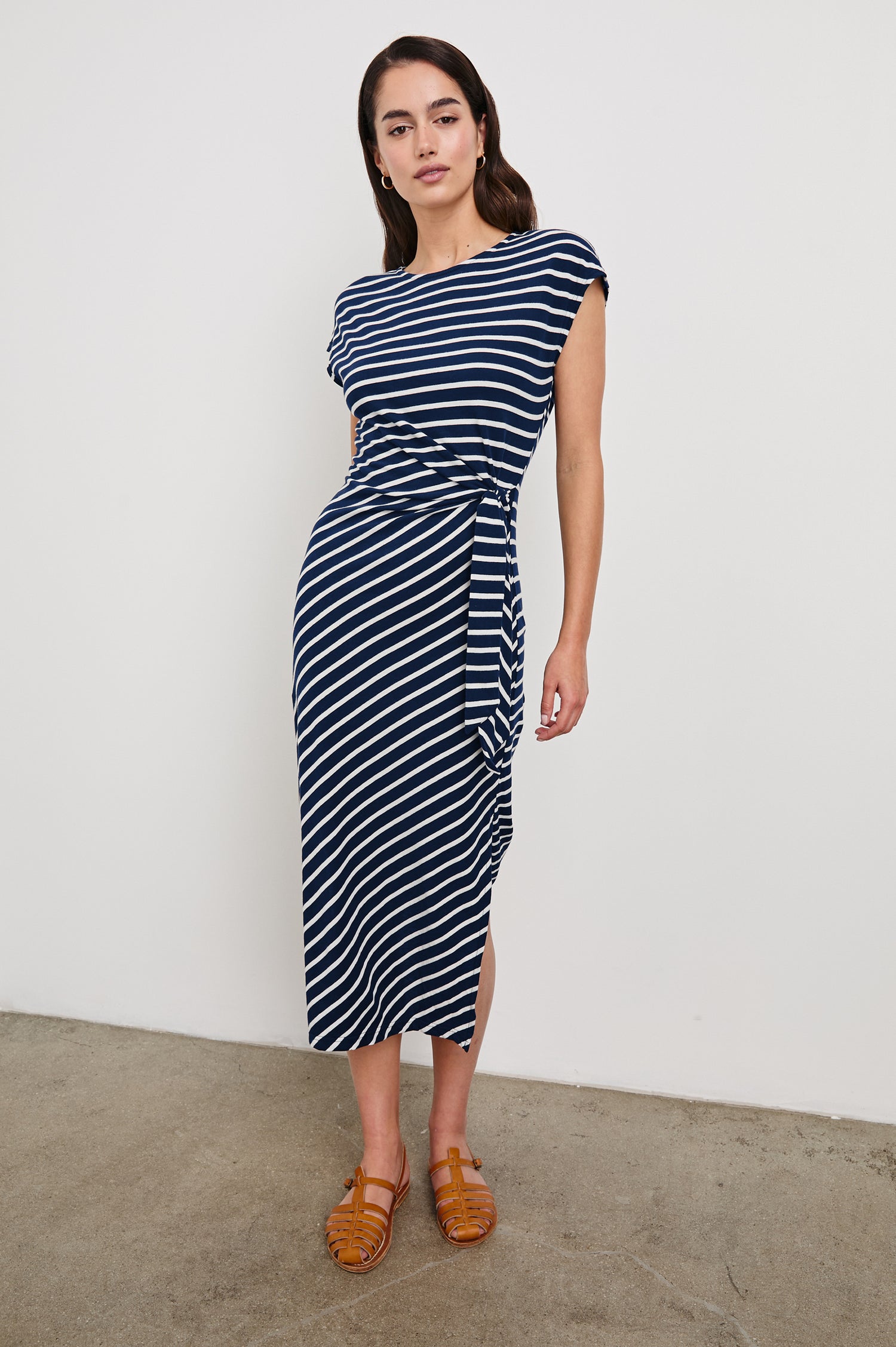 Selah Short Sleeve Jersey Dress With Side Tie In Colorway Navy Ivory Stripe -  Full Front Body View Featured On Model In Motion