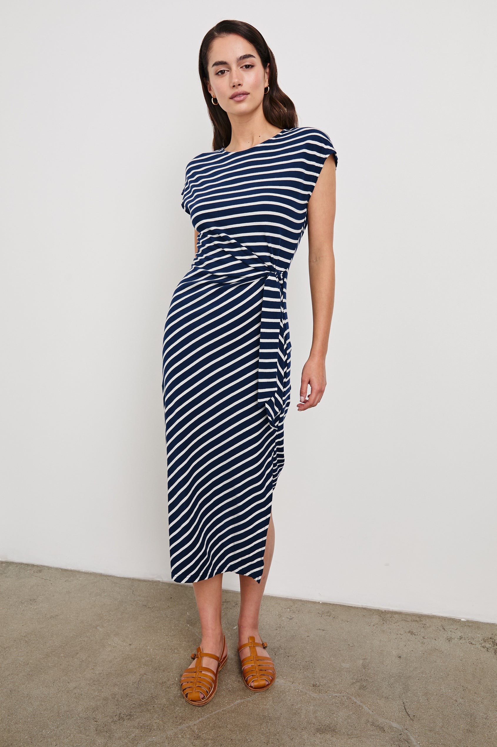 Selah Short Sleeve Jersey Dress With Side Tie In Colorway Navy Ivory Stripe -  Full Front Body View Featured On Model In Motion