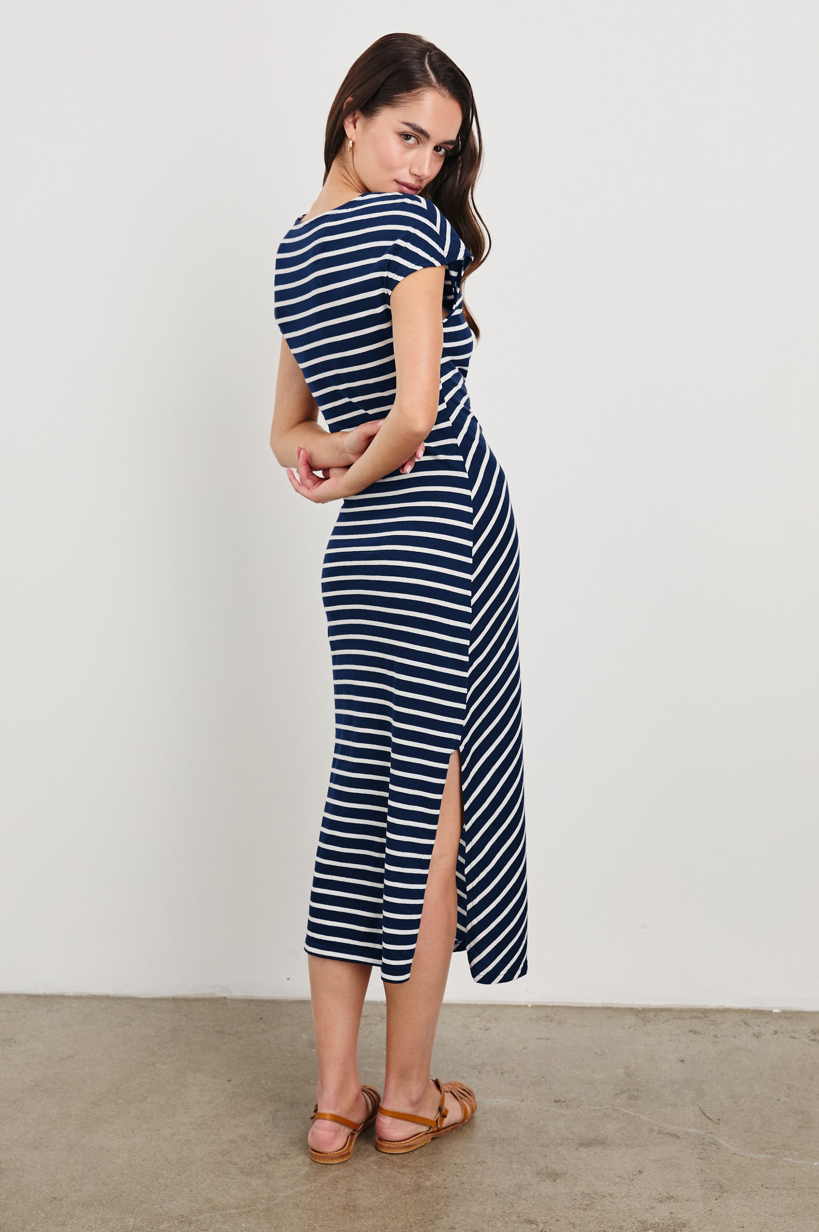 Selah Short Sleeve Jersey Dress With Side Tie In Colorway Navy Ivory Stripe - Back View Featured On Model