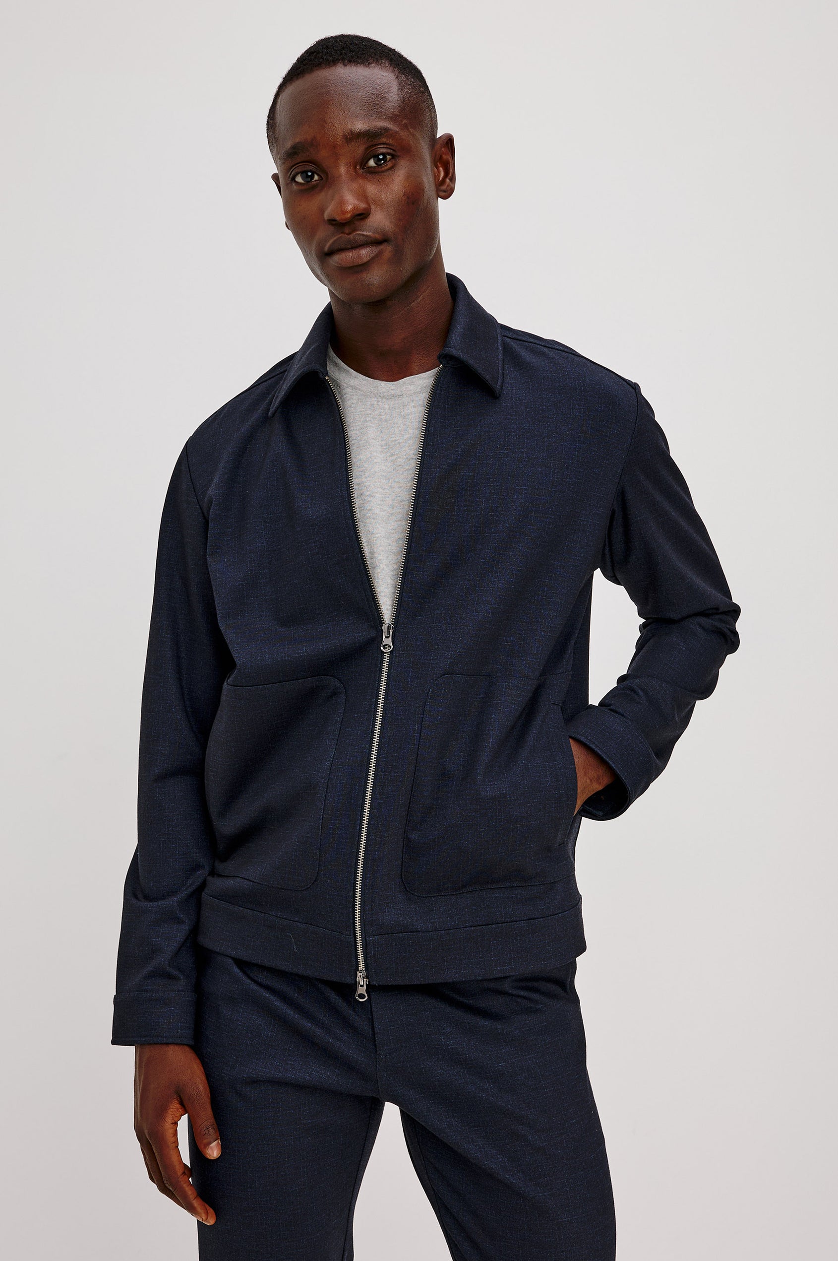 Shael Jacket in Stretch Ponte With Point Collar, Zip Front, and Double Welt Pockets in Navy Colorway - Upper Body Front View Featured on Model