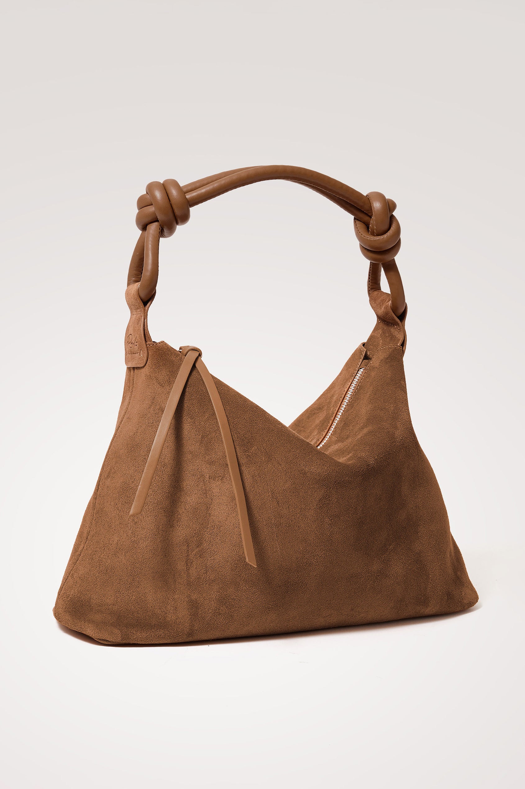 Siena Hobo Bag in Suede With Knotted Top Strap, Zip Closure With Fringe Tassel Pull, Microsuede Lining, Snap-Button Slip Pocket and Foil Logo Stamp at Interior in Camel Suede Colorway - Front Product View Featured