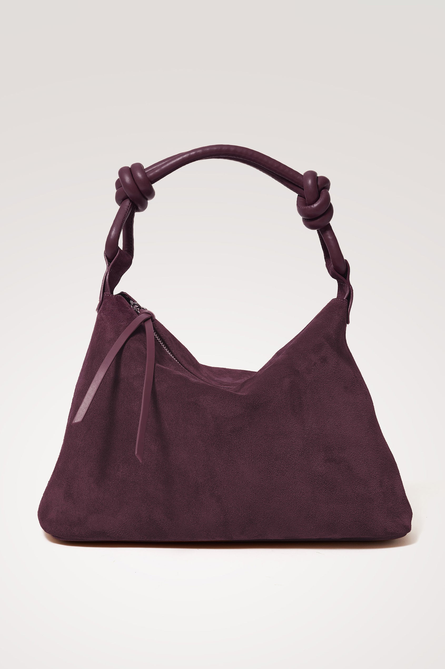 Siena Hobo Bag in Suede With Knotted Top Strap, Zip Closure With Fringe Tassel Pull, Microsuede Lining, Snap-Button Slip Pocket and Foil Logo Stamp at Interior in Plum Suede Colorway -