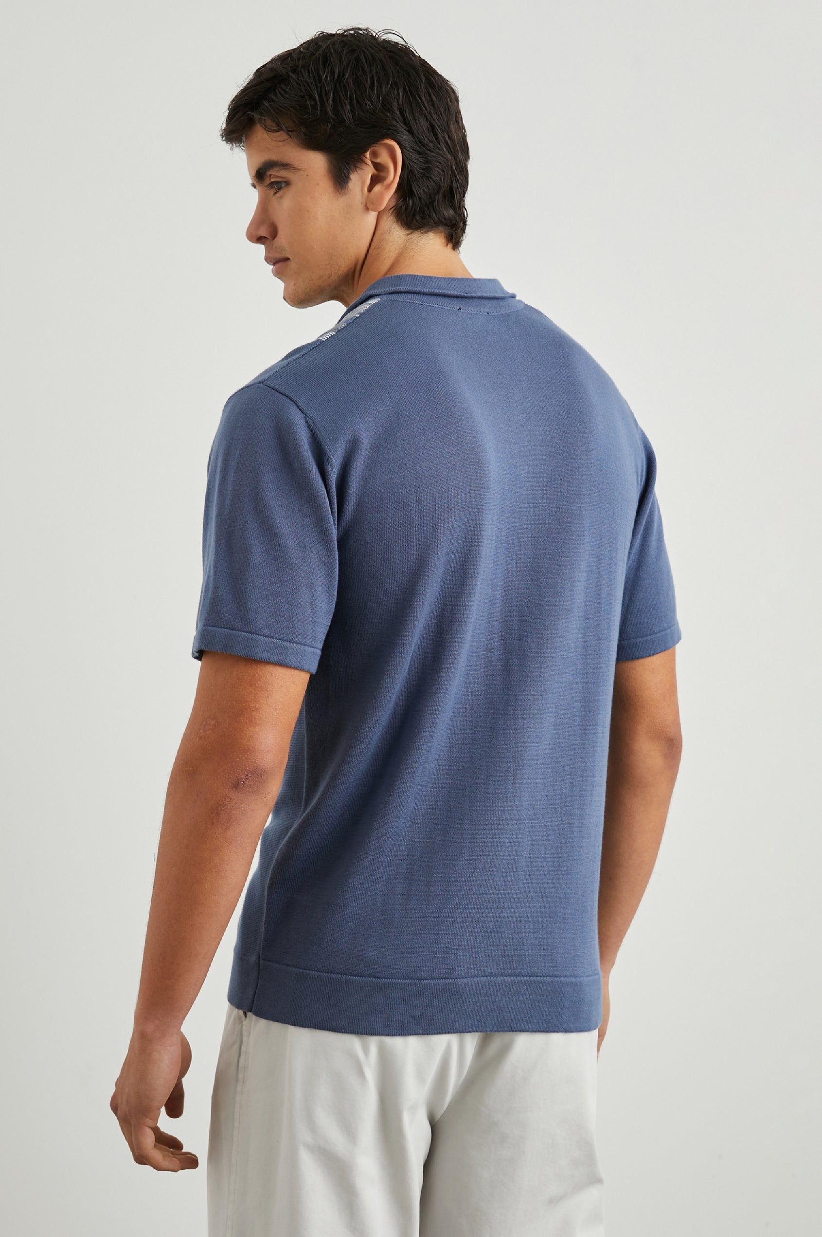 Silas Short-Sleeve Button Up in Marrakesh Blue Multi Colorway, with two front sections of vertical stripes in white and grey - Back View Featured on Model