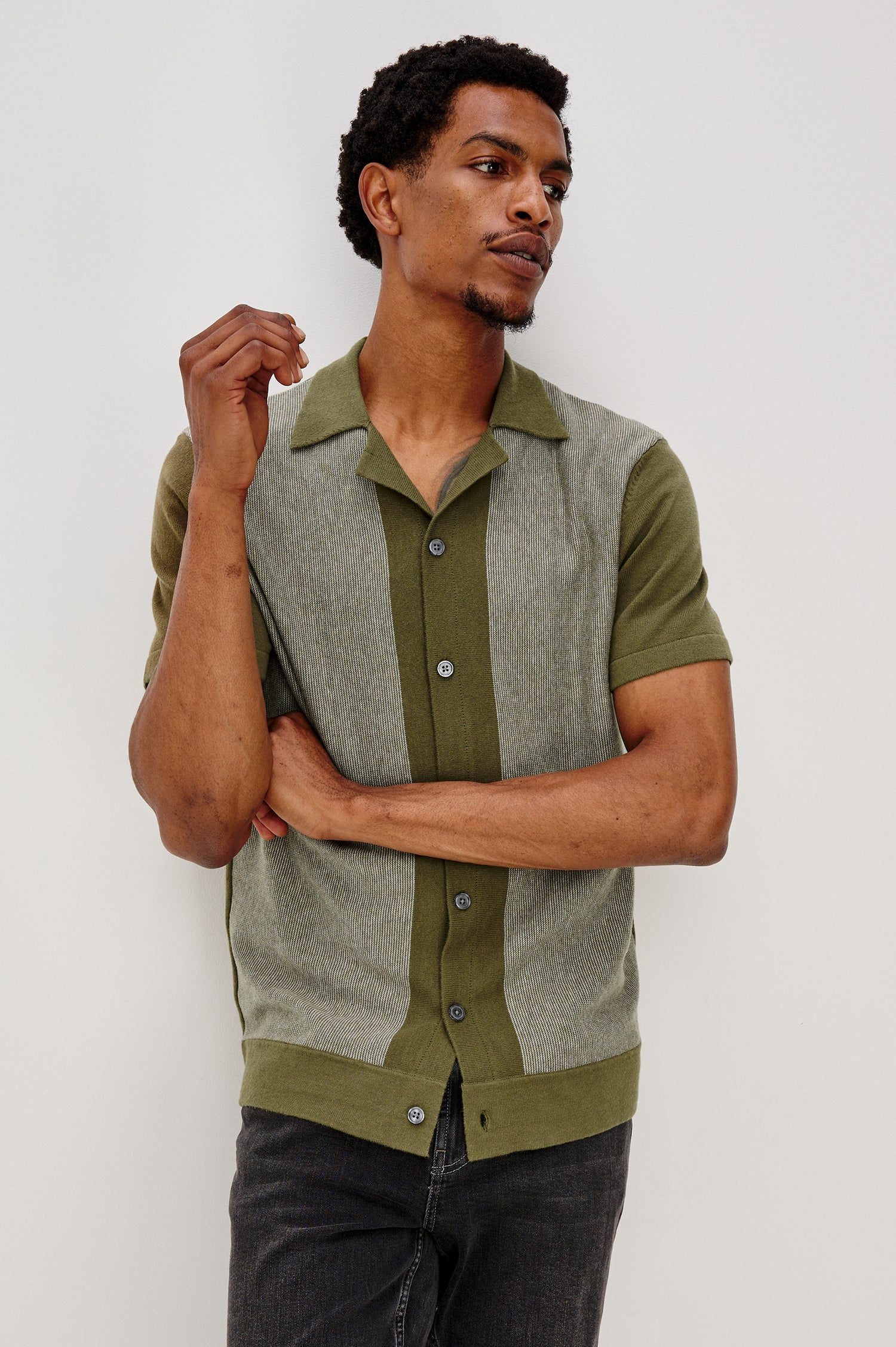 Silas short sleeve knit button down shirt with retro front striped design features in Olive Khaki Stripe - front view on model