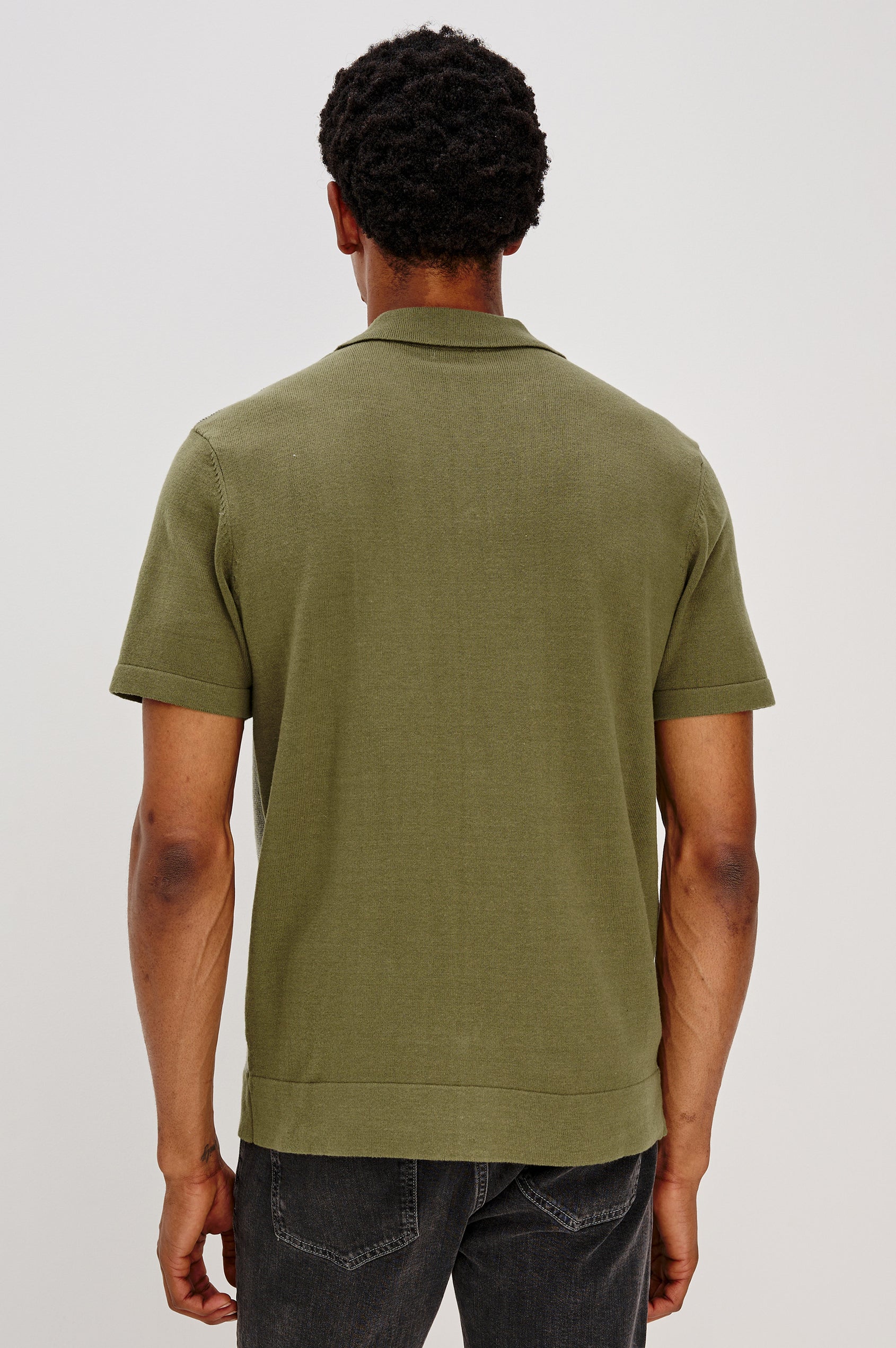 Silas short sleeve knit button down shirt with retro front striped design features in Olive Khaki Stripe - back view on model
