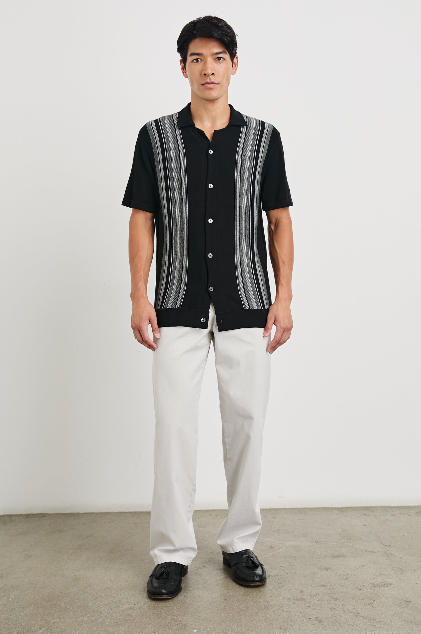 Silas Short-Sleeve Button Up in Raven Multi Colorway, with two front sections of vertical stripes in white and greys - Front Full Body View Featured on Model