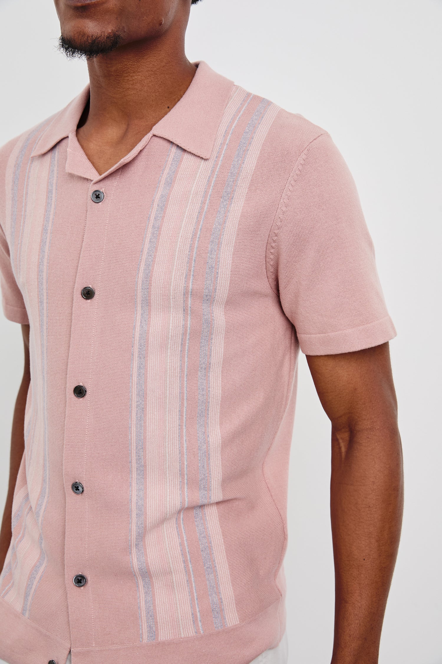 Silas Short-Sleeve Button Up in Rose Multi Colorway, with two front sections of vertical stripes in pinks, creams, and blues - Front View Featured on Model