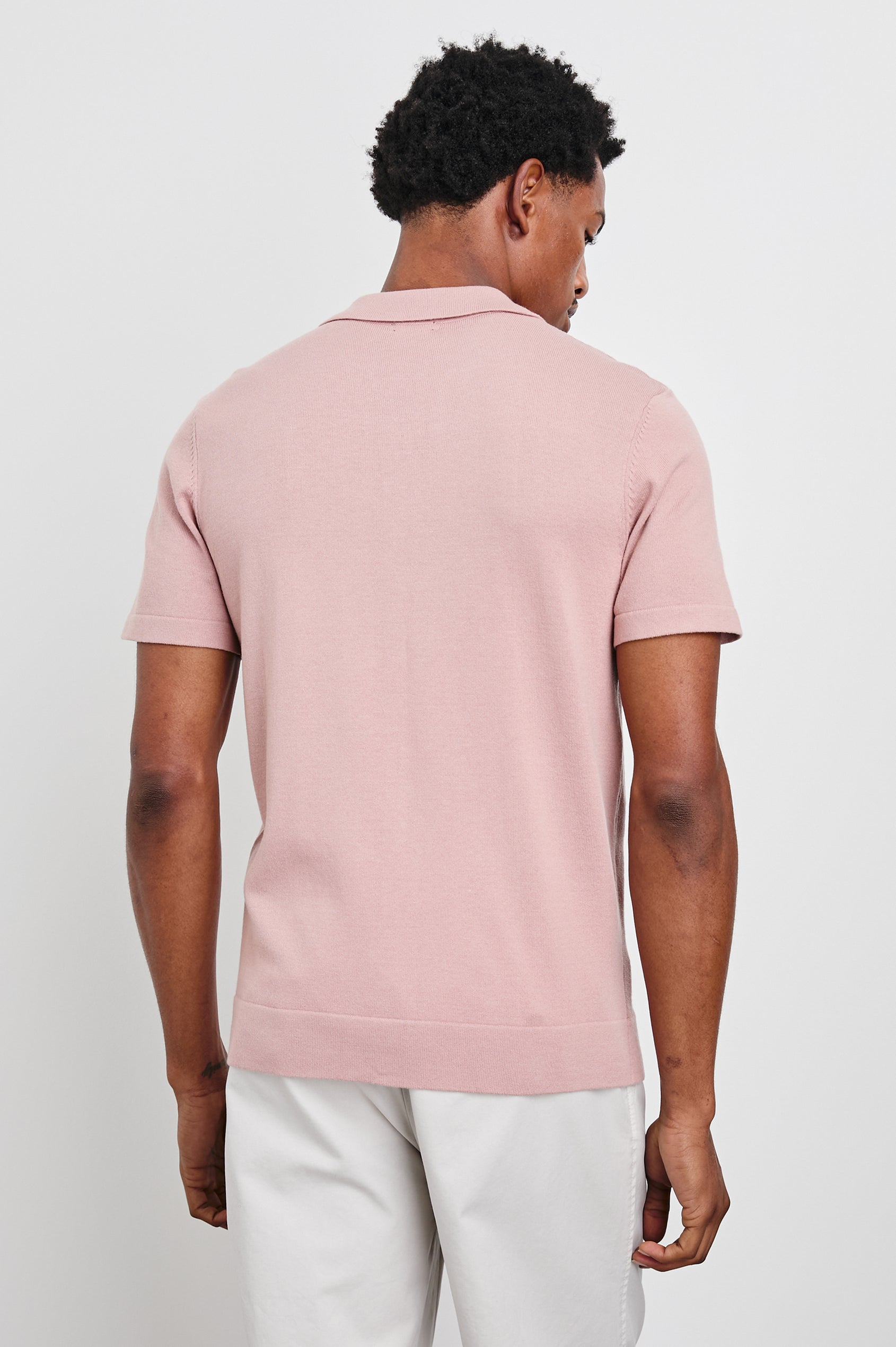 Silas Short-Sleeve Button Up in Rose Multi Colorway, with two front sections of vertical stripes in pinks, creams, and blues - Back View Featured on Model