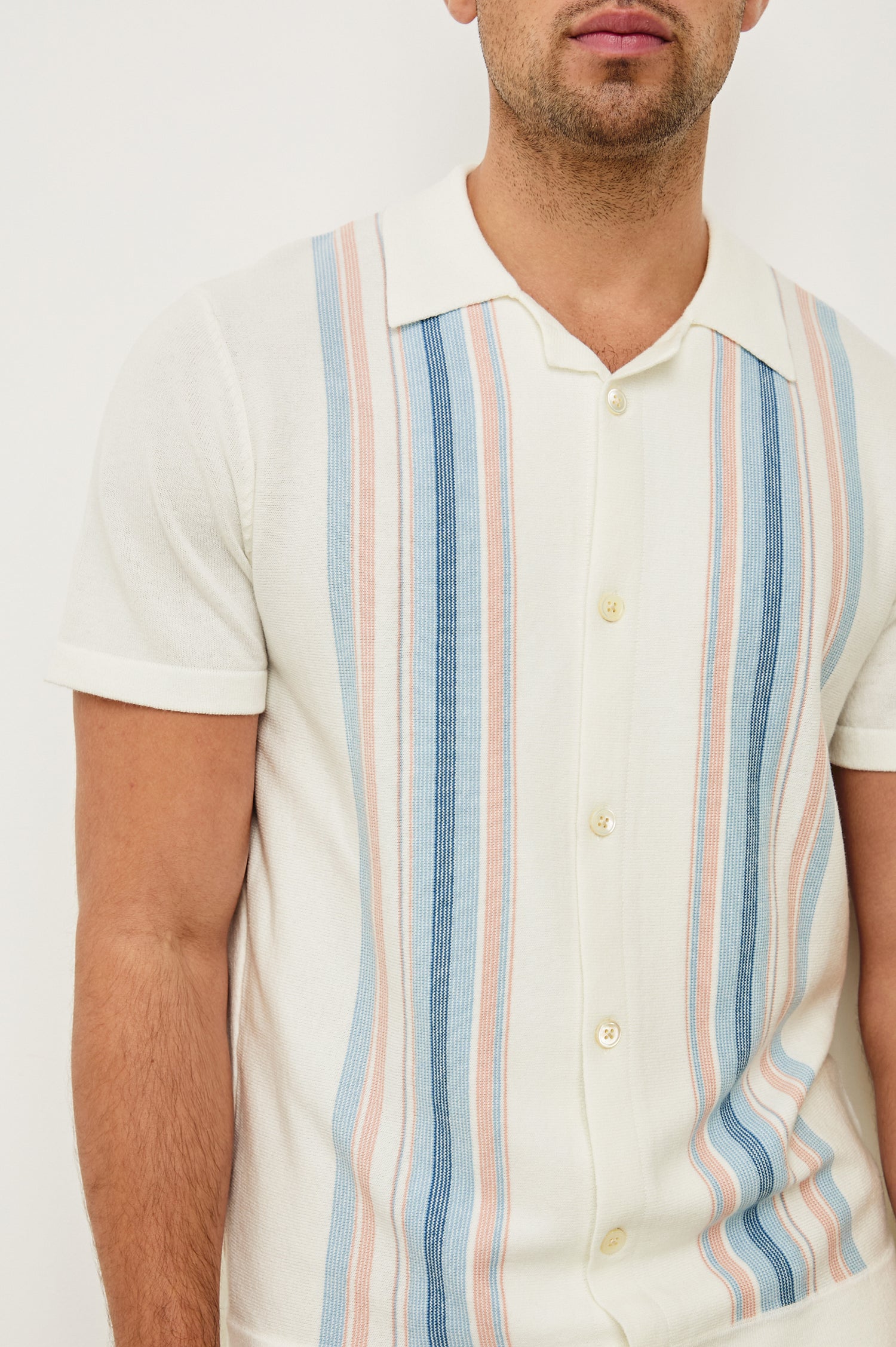 Silas short sleeve knit button down shirt with retro front striped design features in Sky Pink Multi - close up of details on model