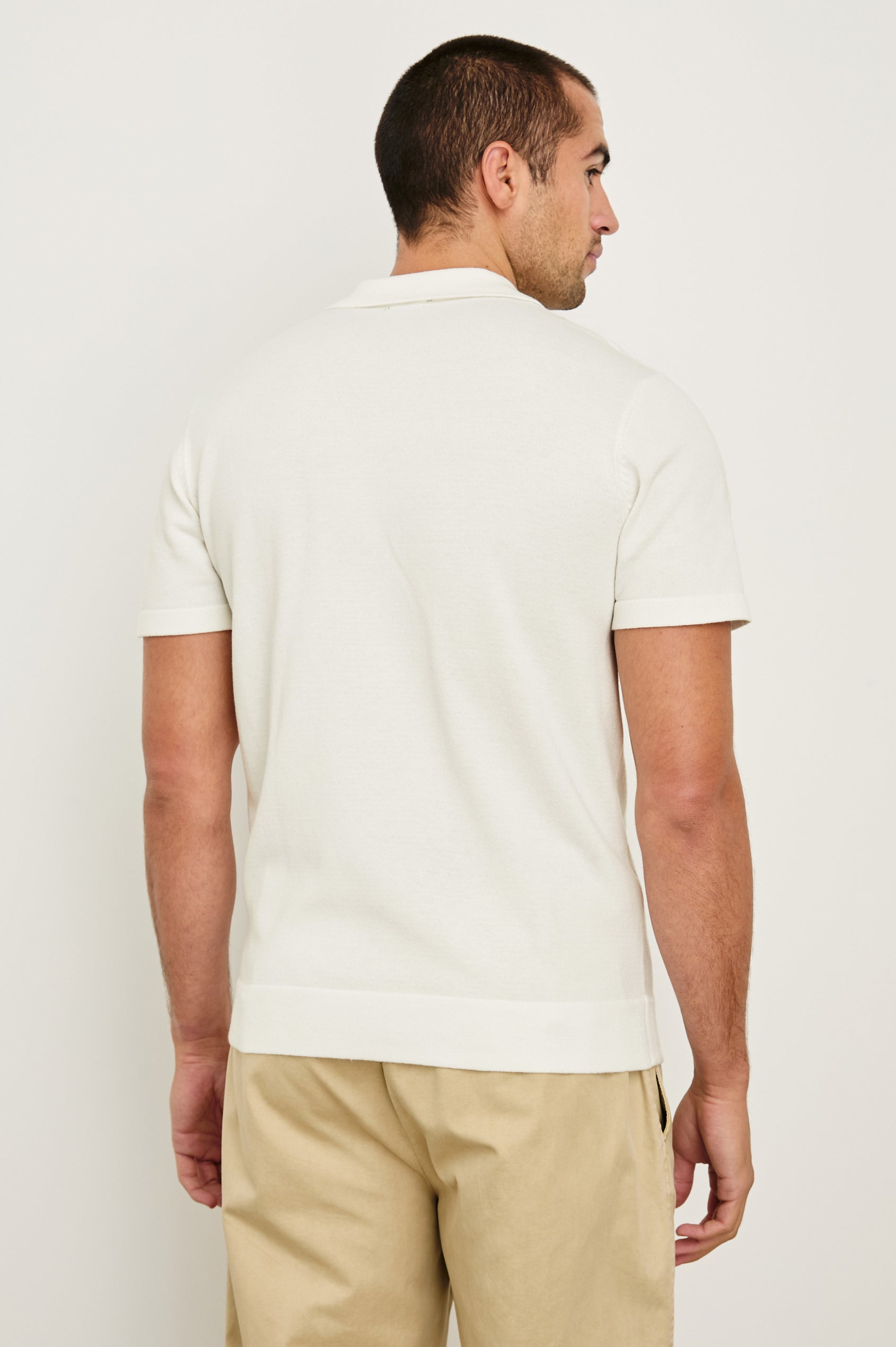 Silas short sleeve knit button down shirt with retro front striped design features in Sky Pink Multi - back view on model