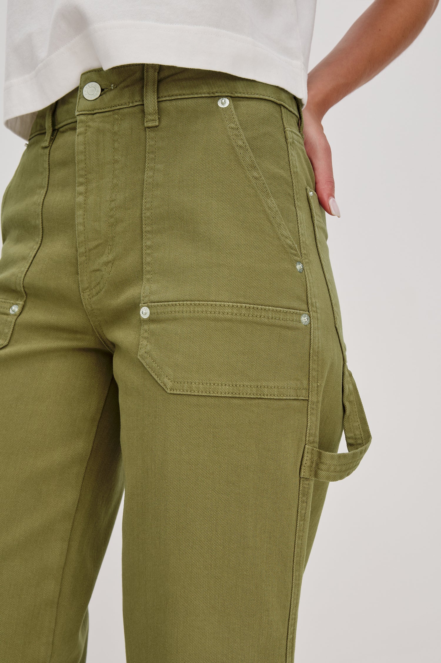 Silverado high rise wide leg crop pant with carpenter style details and contrast stitching in Dark Olive - front detail view on model