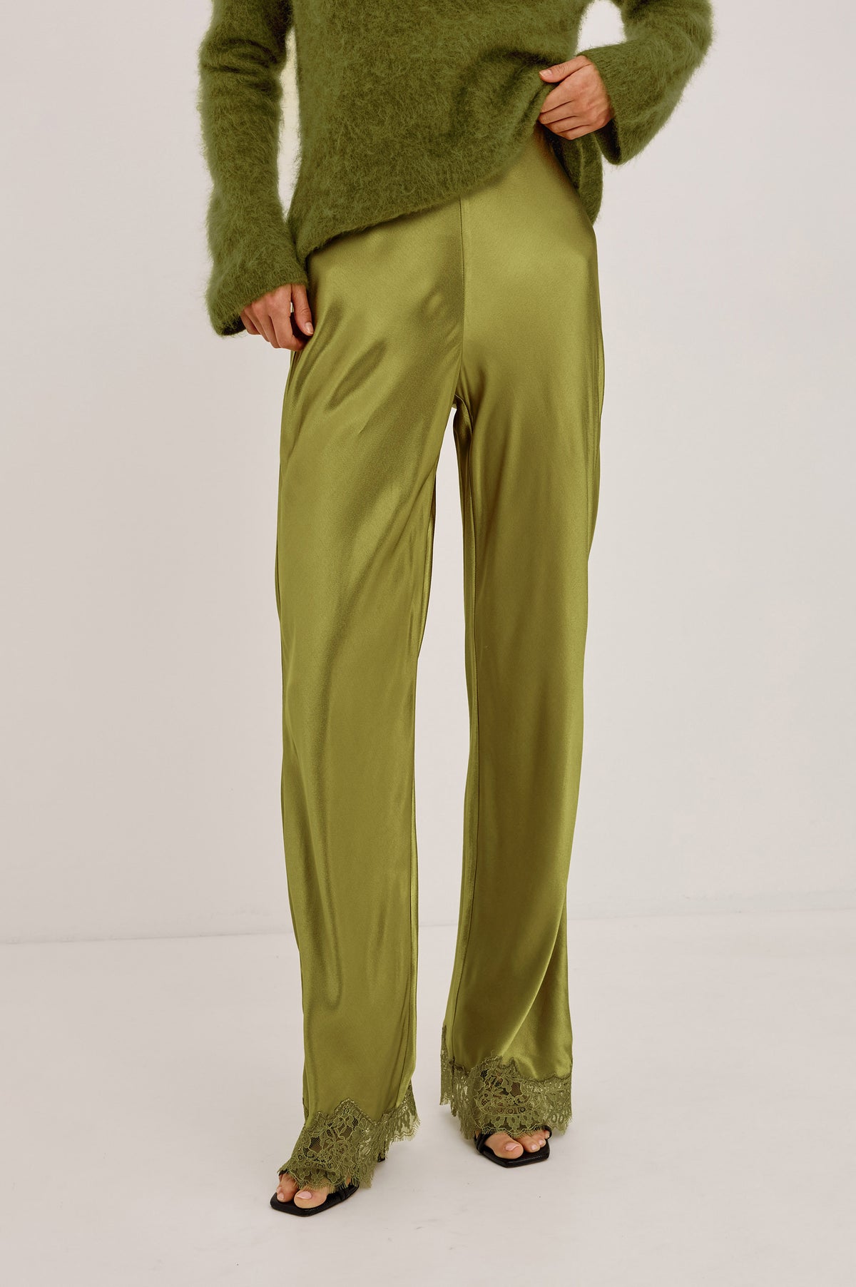 Silvi Pant in Satin-Back Crepe With Straight Legs, Elastic Waist, and Lace Hem in Celery Colorway - Upper Body Front View Featured on Model.
