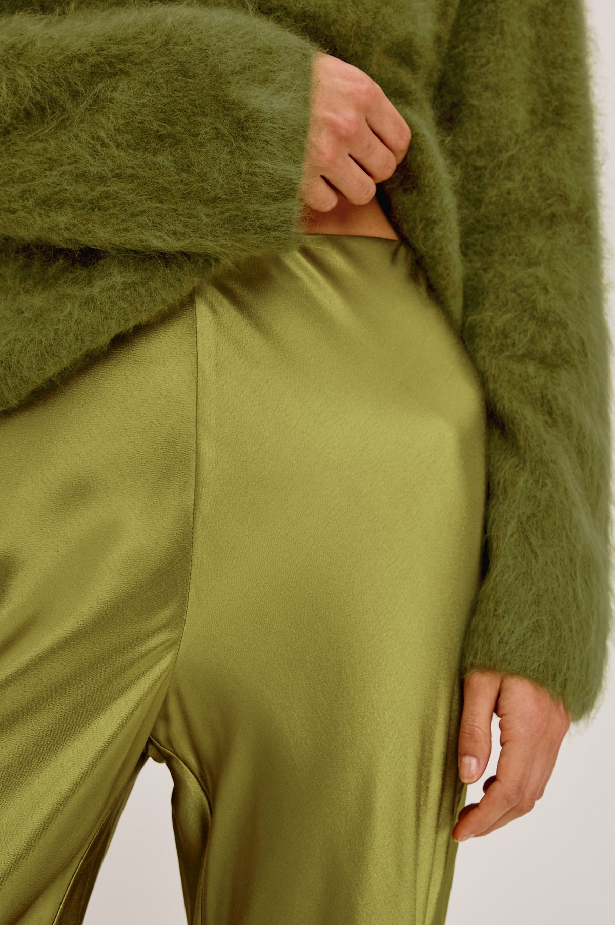 Silvi Pant in Satin-Back Crepe With Straight Legs, Elastic Waist, and Lace Hem in Celery Colorway - Upper Body Front Detail View Featured on Model.