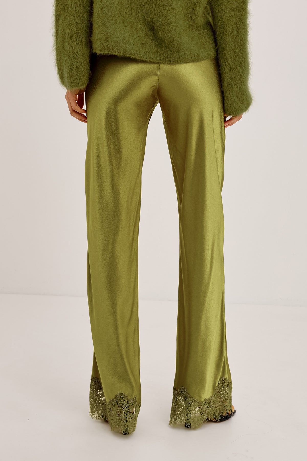 Silvi Pant in Satin-Back Crepe With Straight Legs, Elastic Waist, and Lace Hem in Celery Colorway - Upper Body Back View Featured on Model.